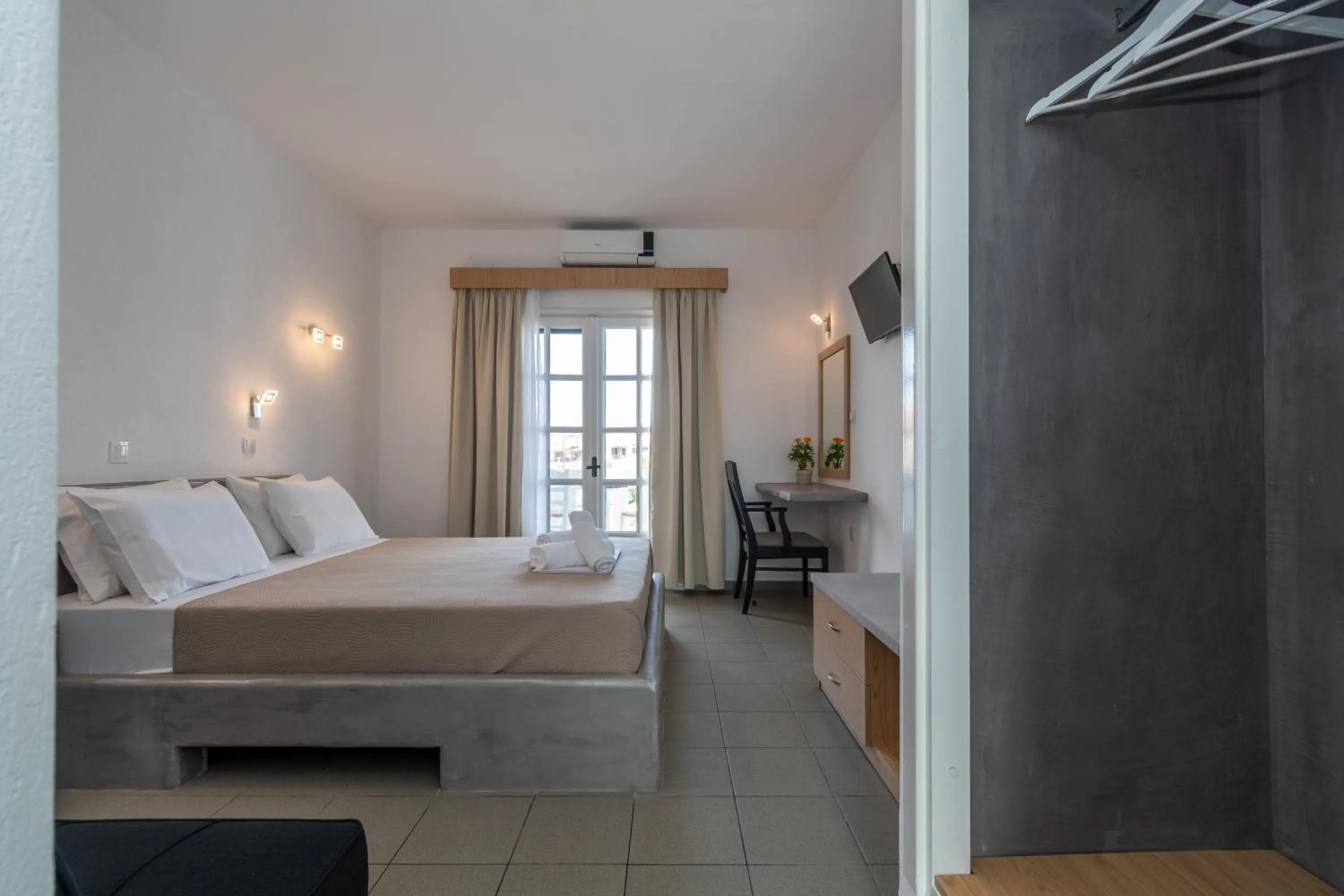 Bed in Astri Hotel
