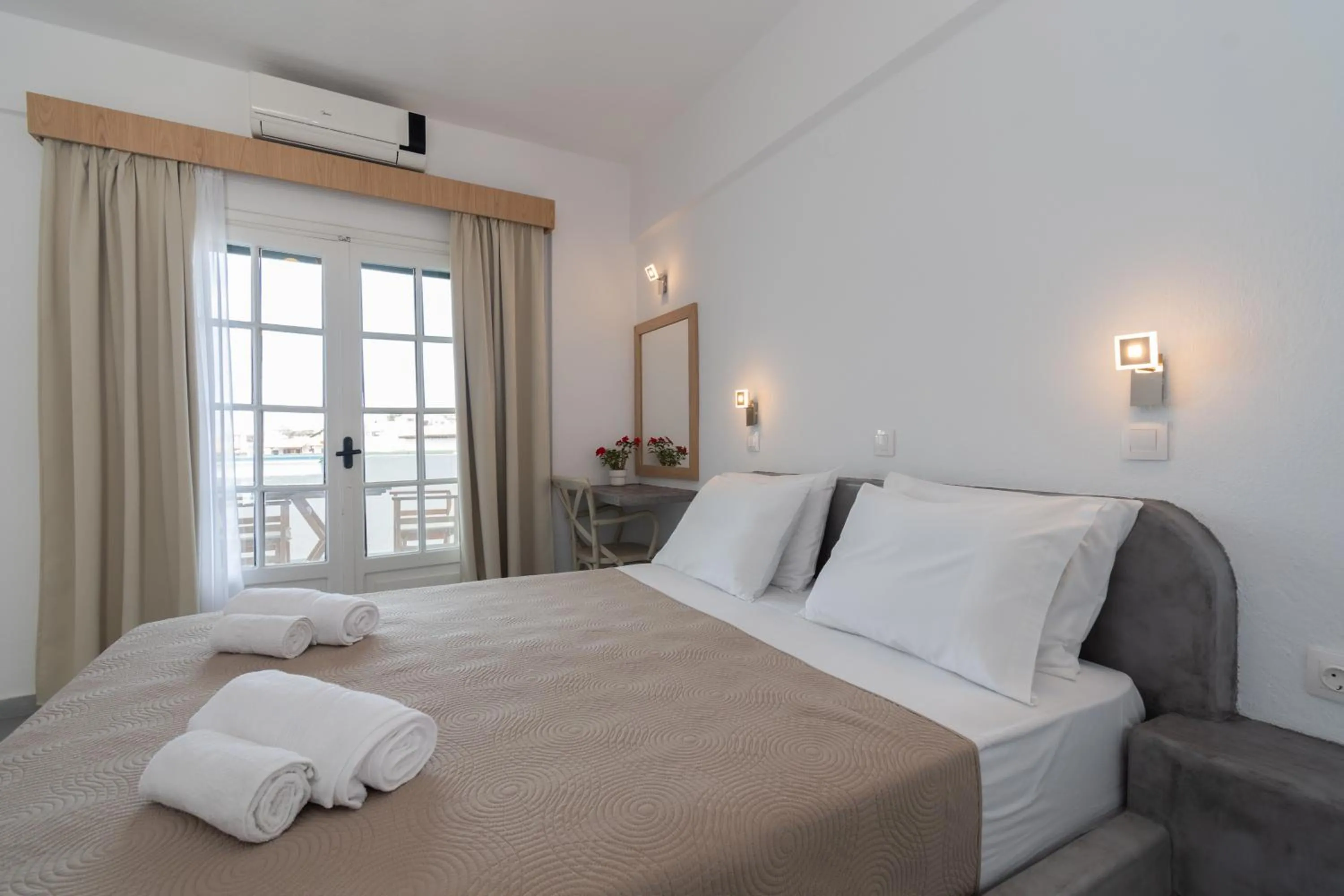 Bed in Astri Hotel
