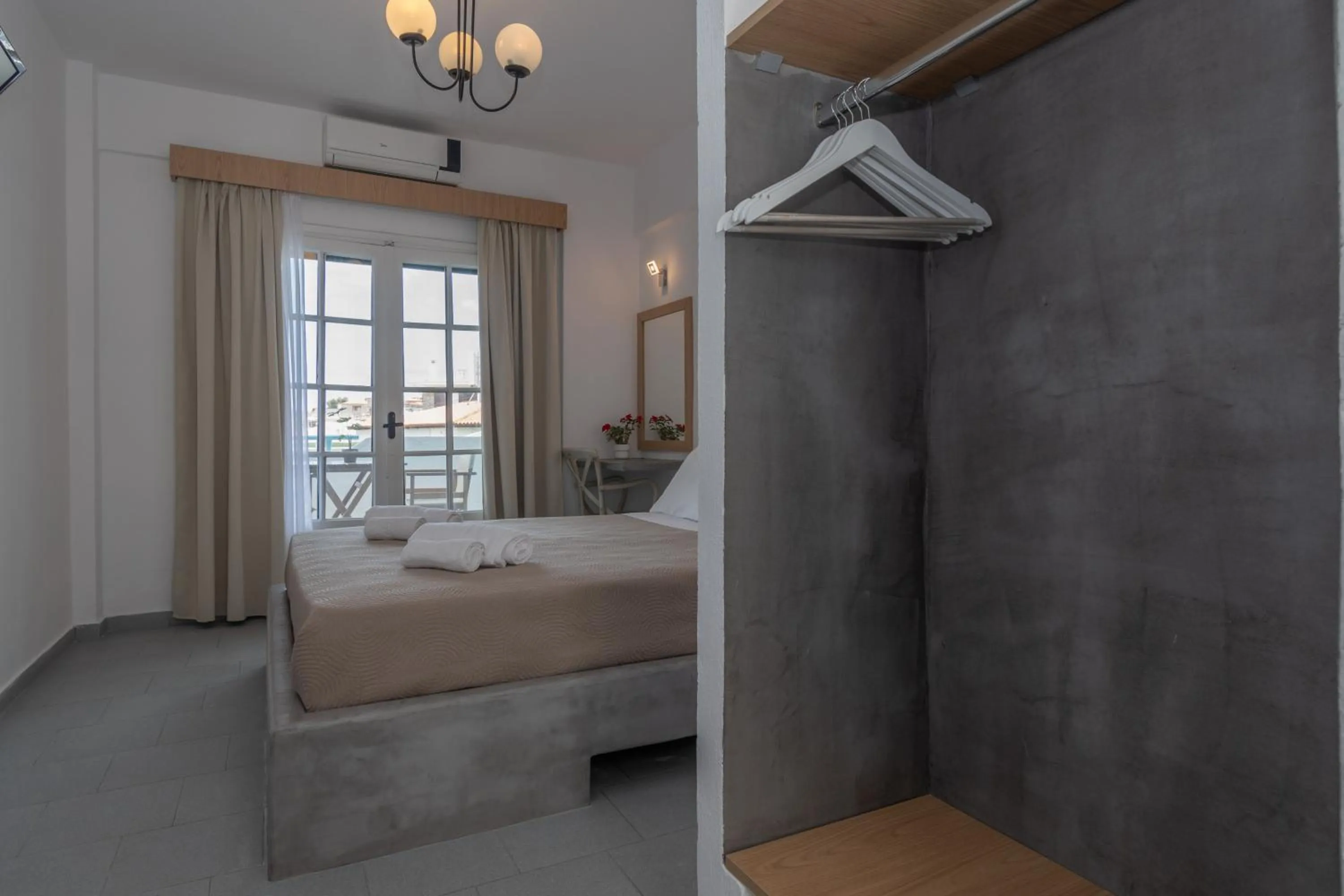 Bed in Astri Hotel