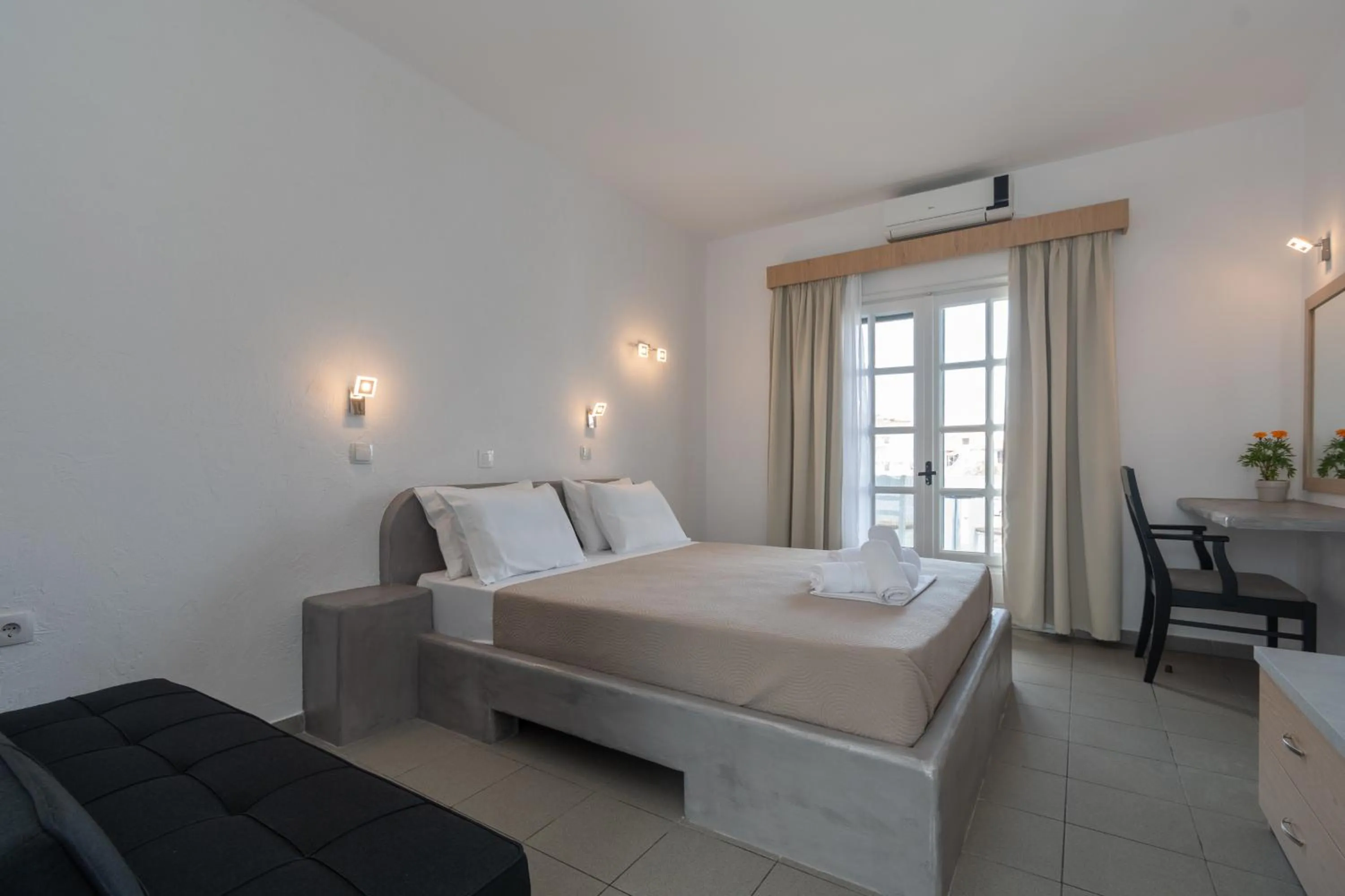 Bed in Astri Hotel