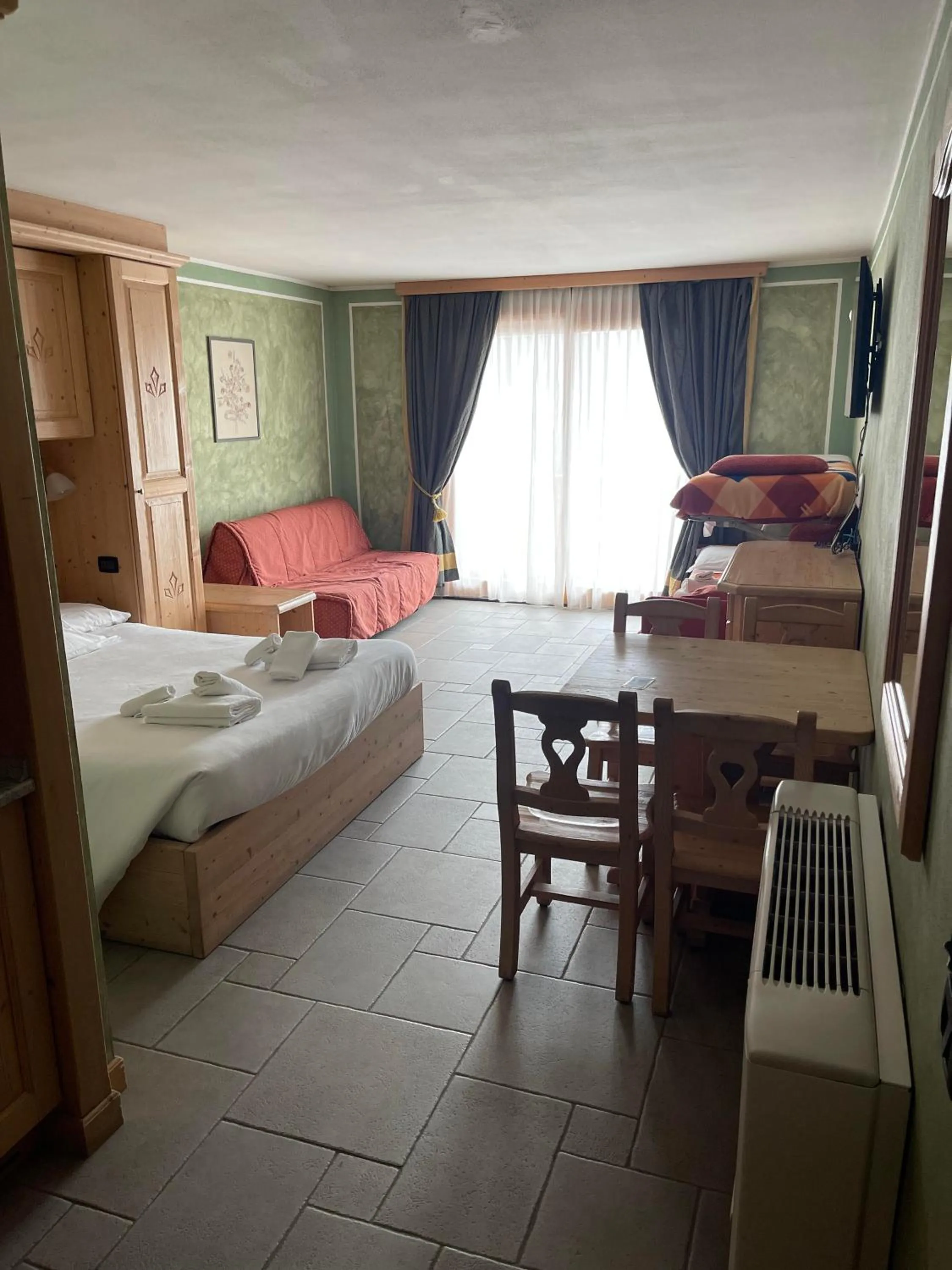 Bed in Boscone Suite Hotel