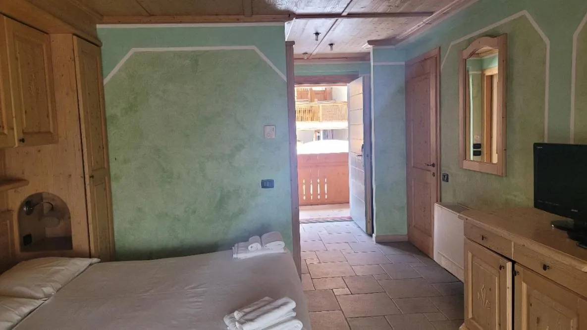 Bed in Boscone Suite Hotel