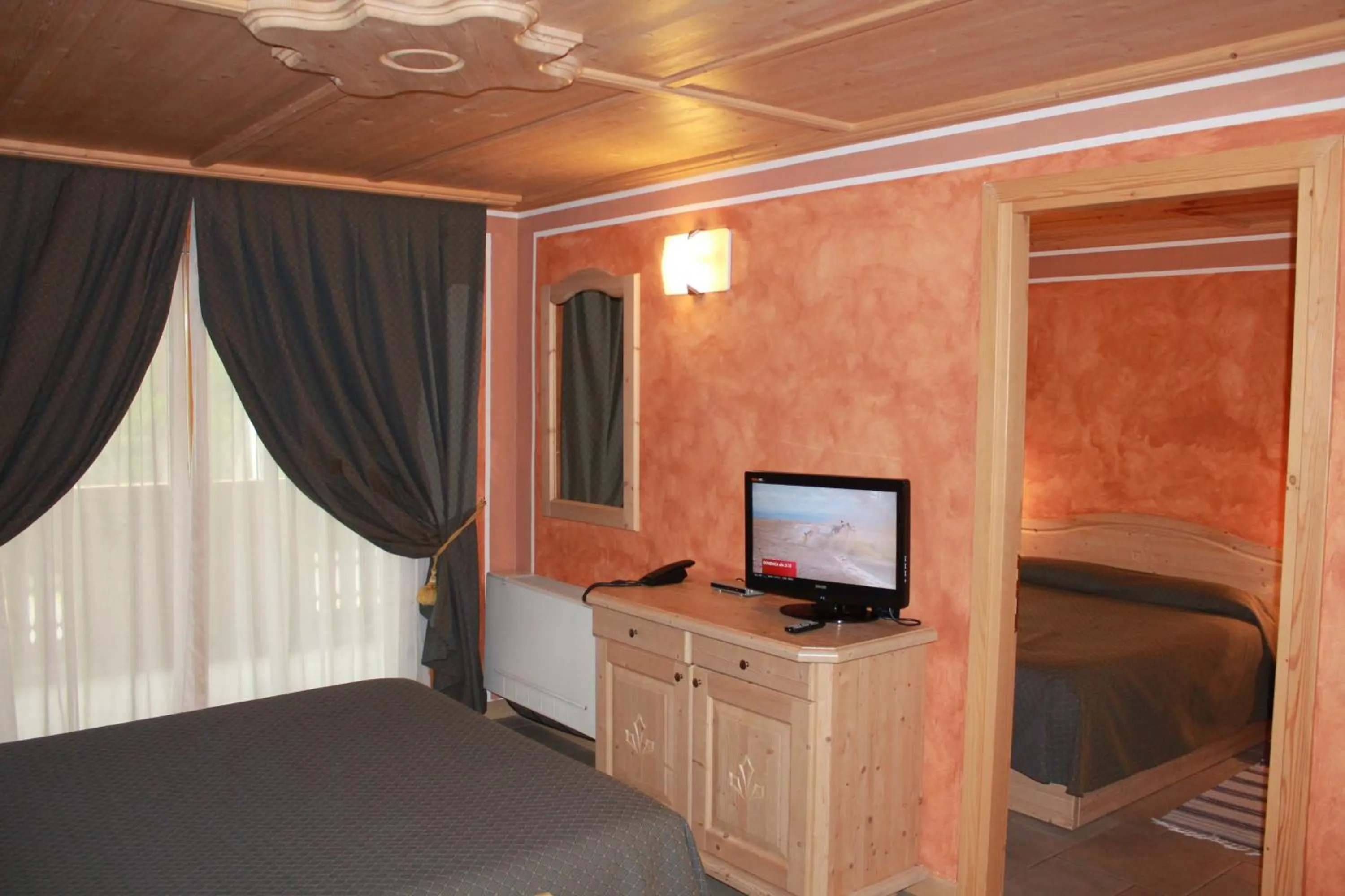 Bed in Boscone Suite Hotel