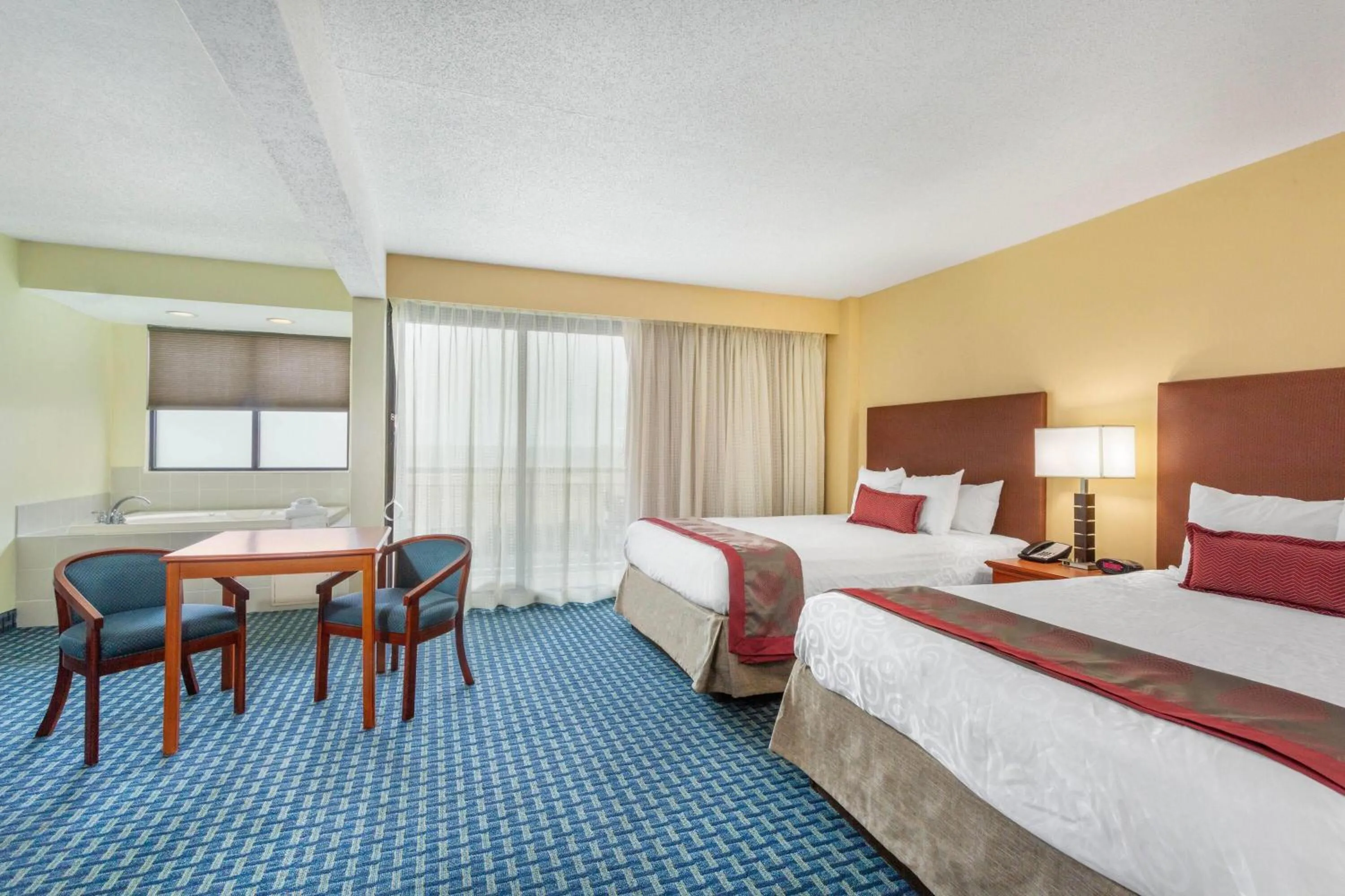 Photo of the whole room, Bed in Ramada Plaza by Wyndham Virginia Beach Oceanfront
