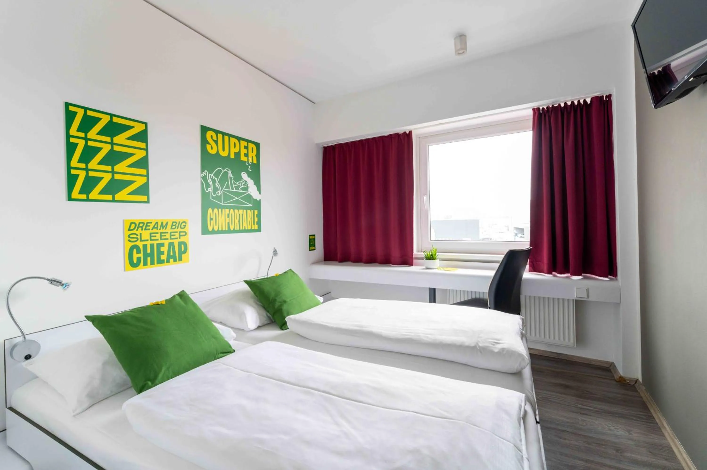 Photo of the whole room, Bed in SLEEEP Hotel Wiener Neudorf