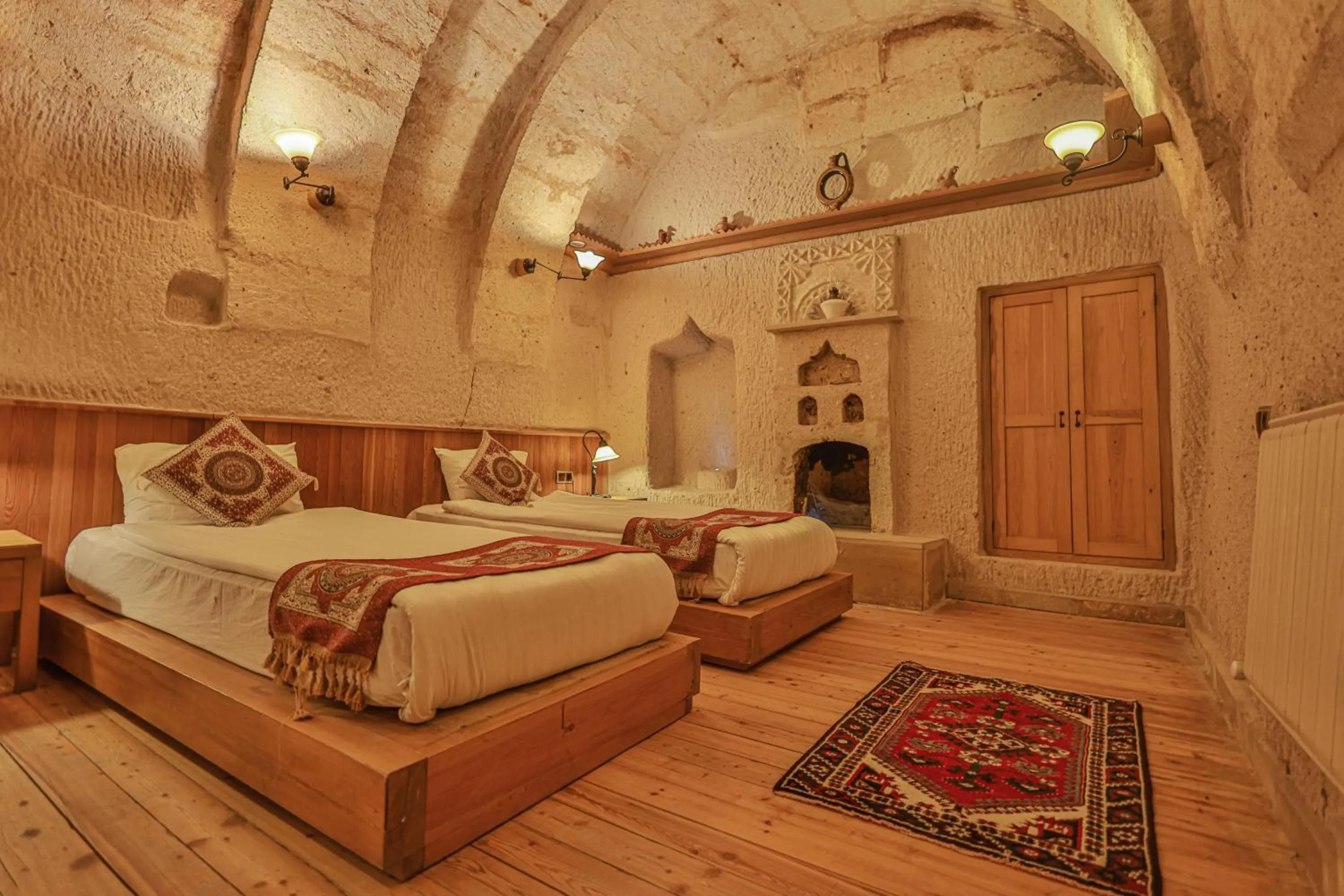 Bed in La Casa Cave Hotel