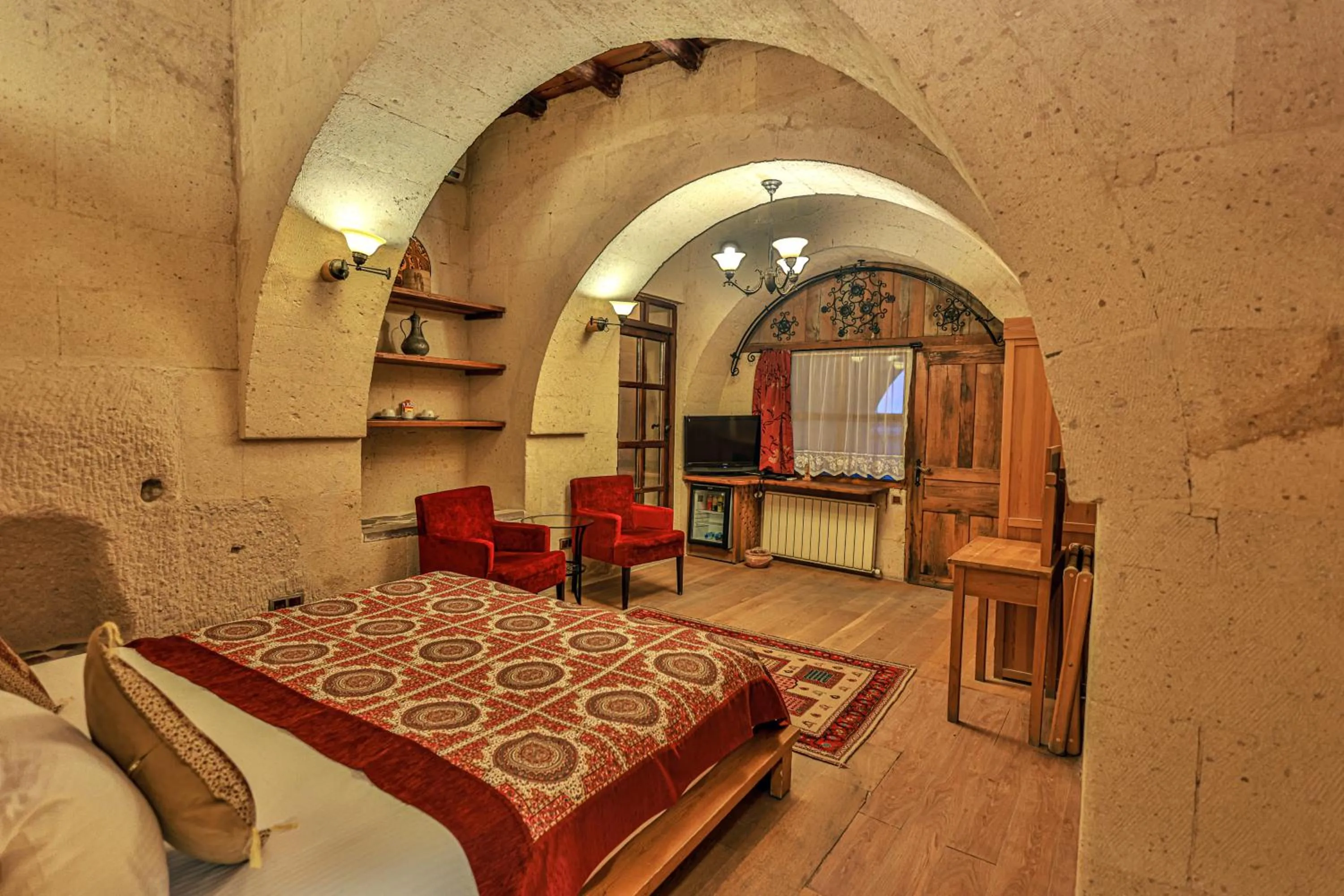 Bed in La Casa Cave Hotel