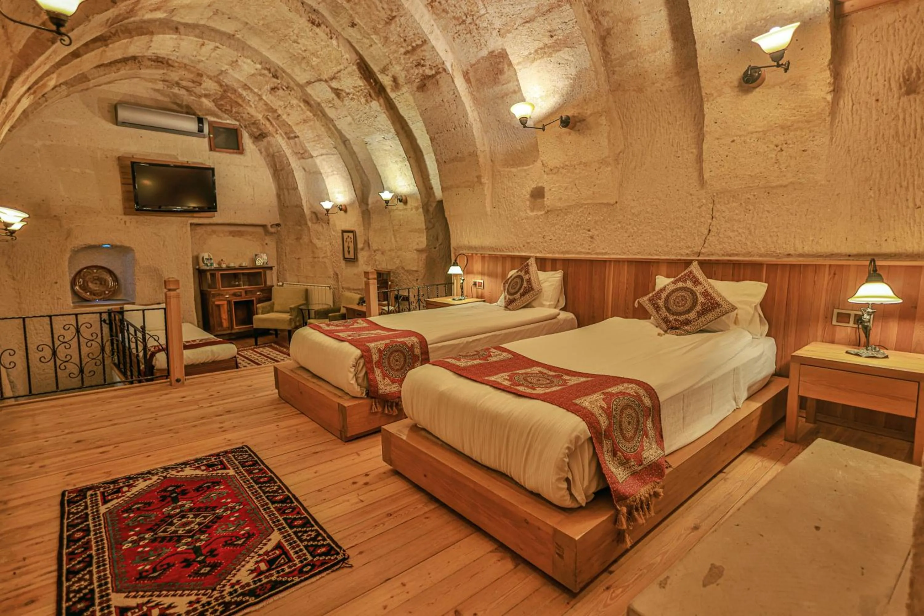 Bed in La Casa Cave Hotel