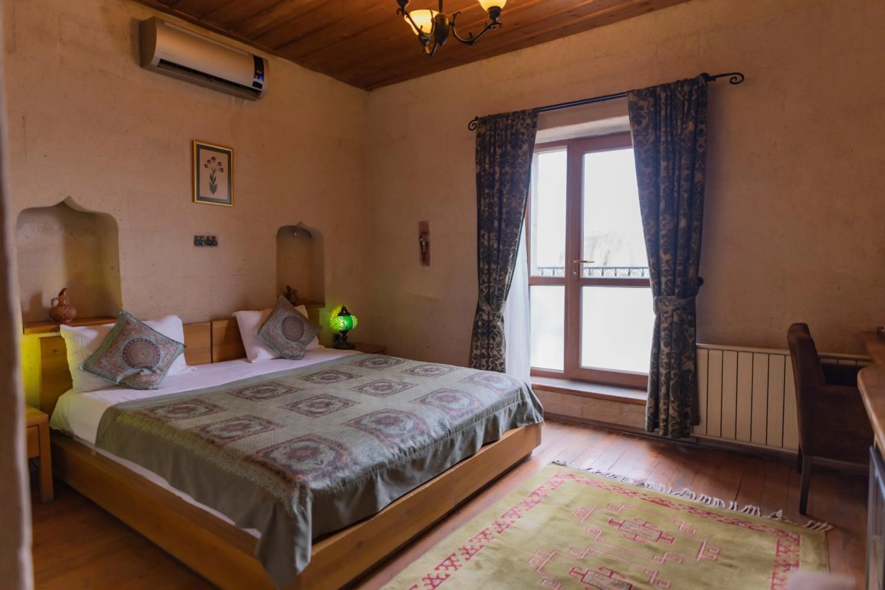 Bed in La Casa Cave Hotel