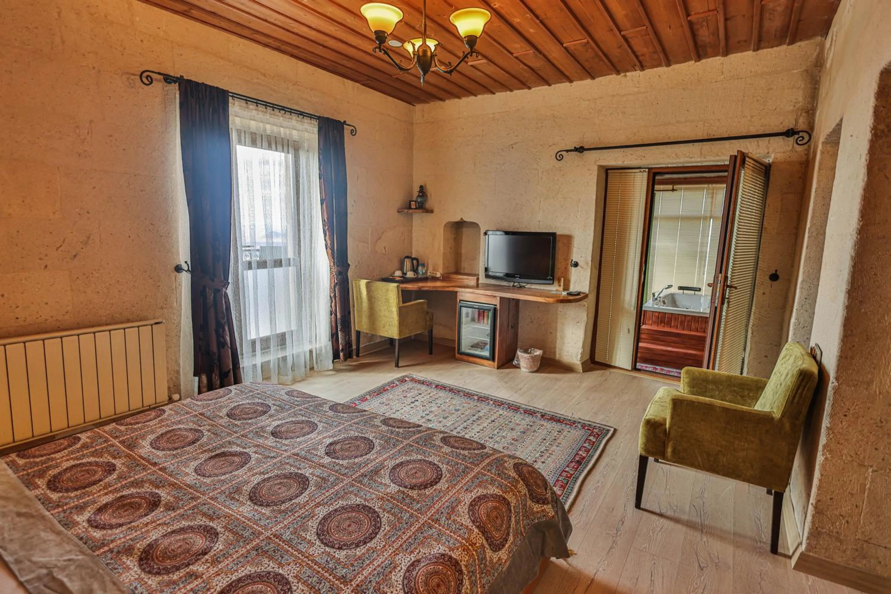 Bed in La Casa Cave Hotel