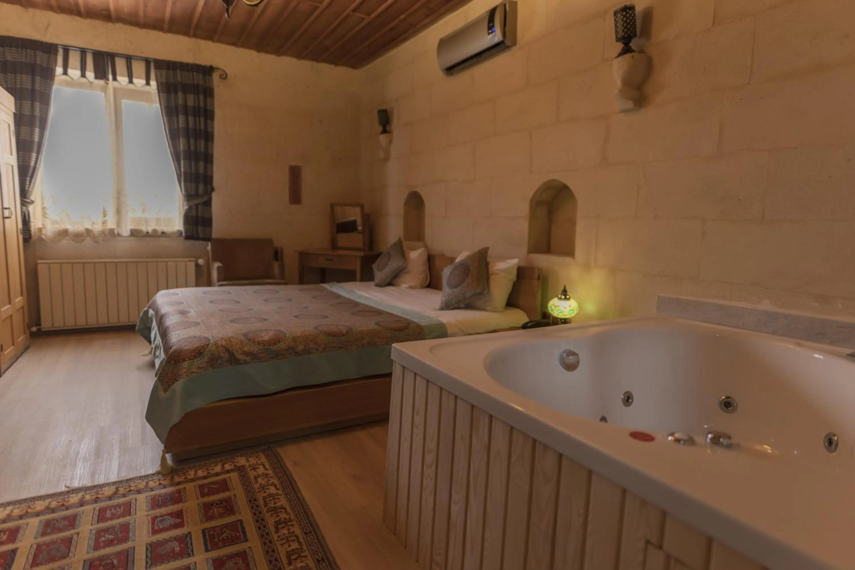 Bed in La Casa Cave Hotel