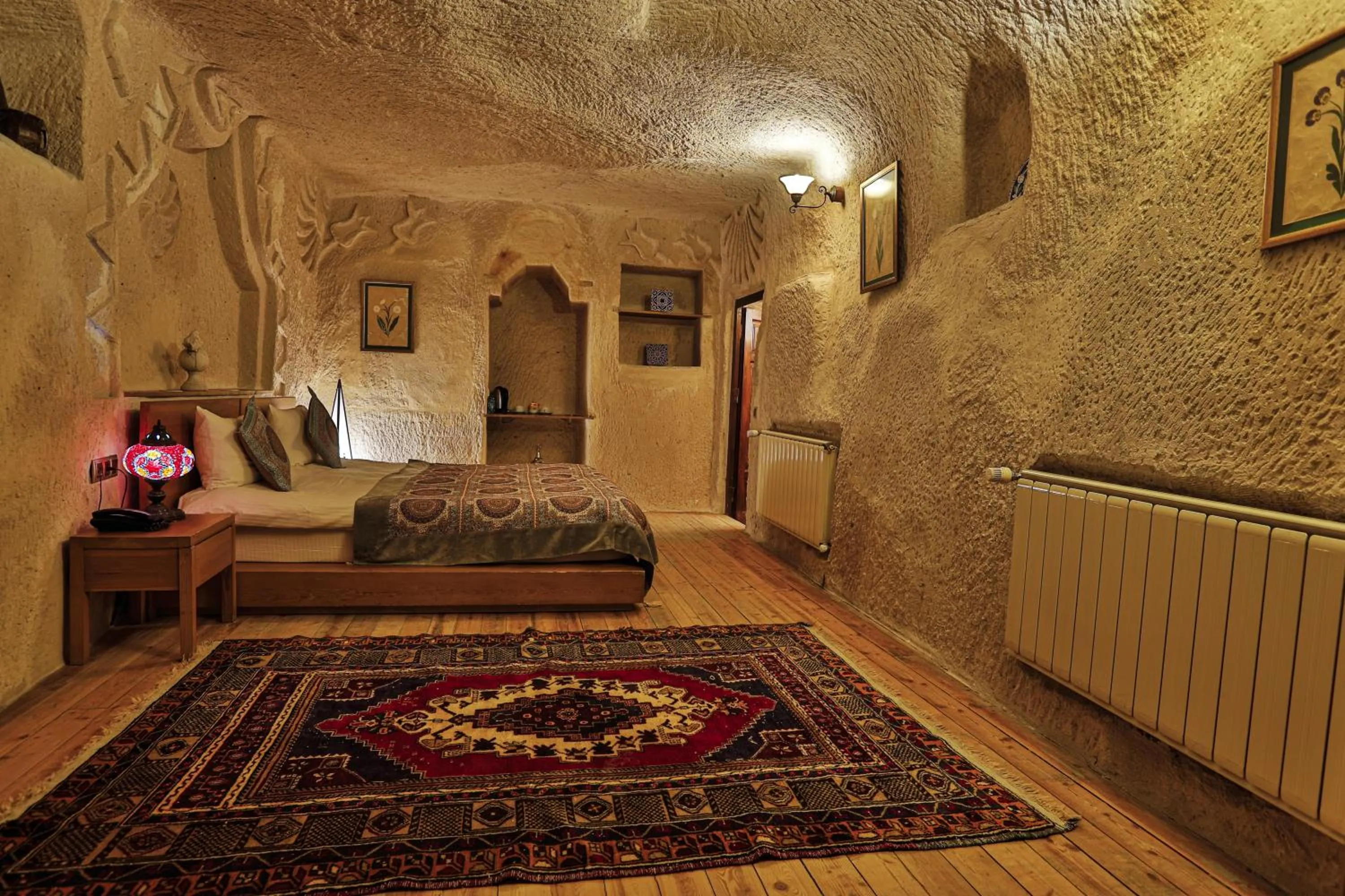 Bed in La Casa Cave Hotel