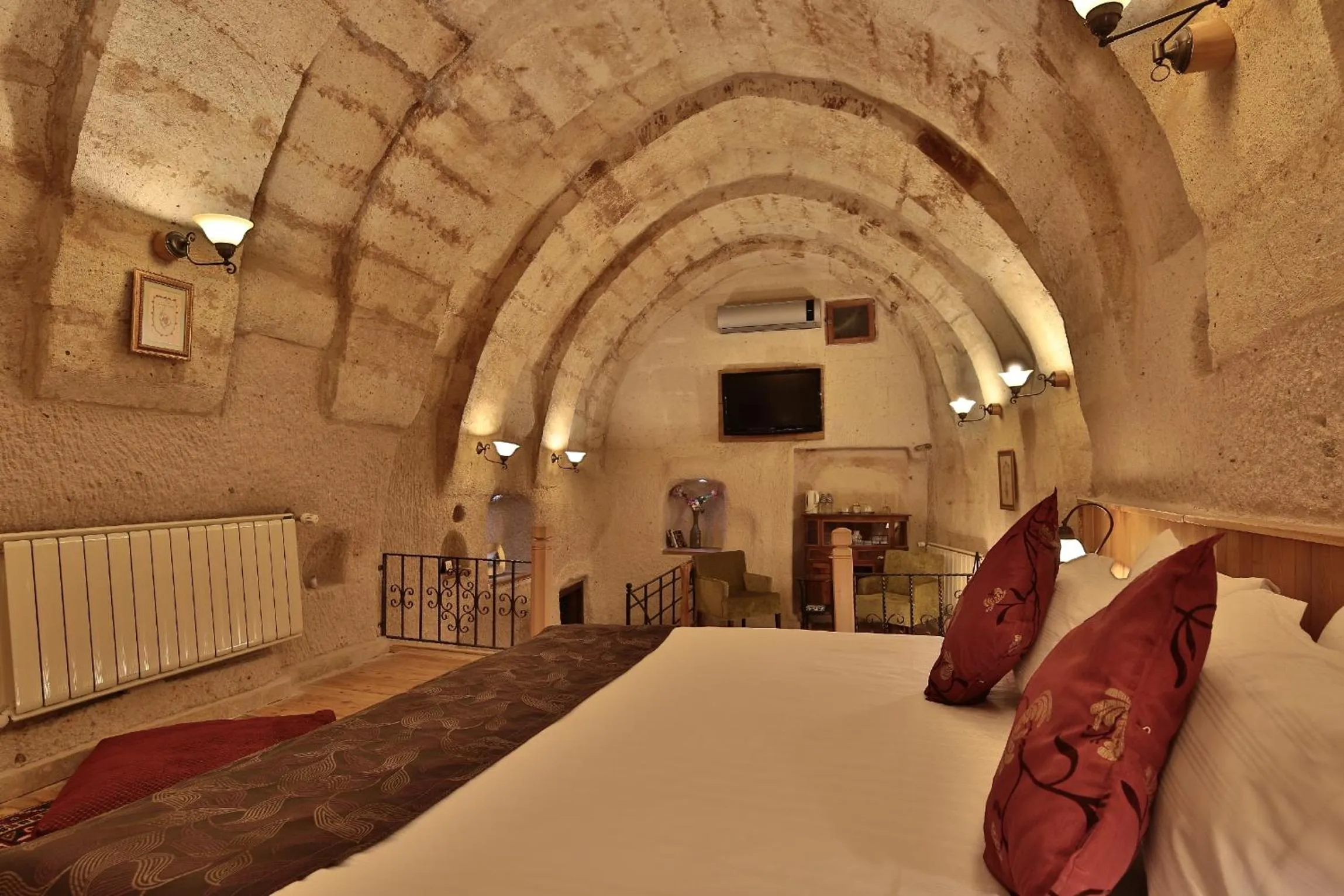 Bed in La Casa Cave Hotel