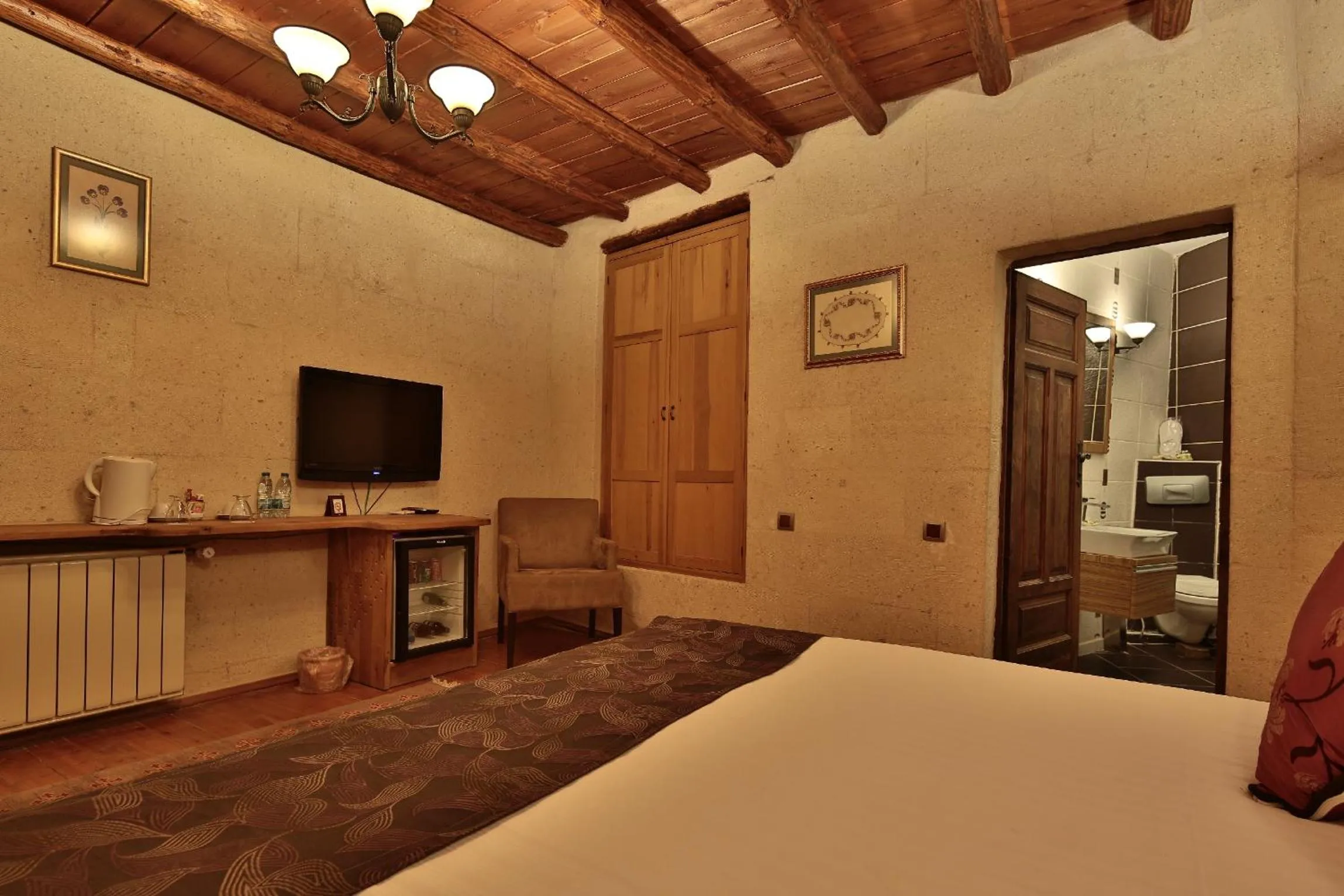 Bed in La Casa Cave Hotel