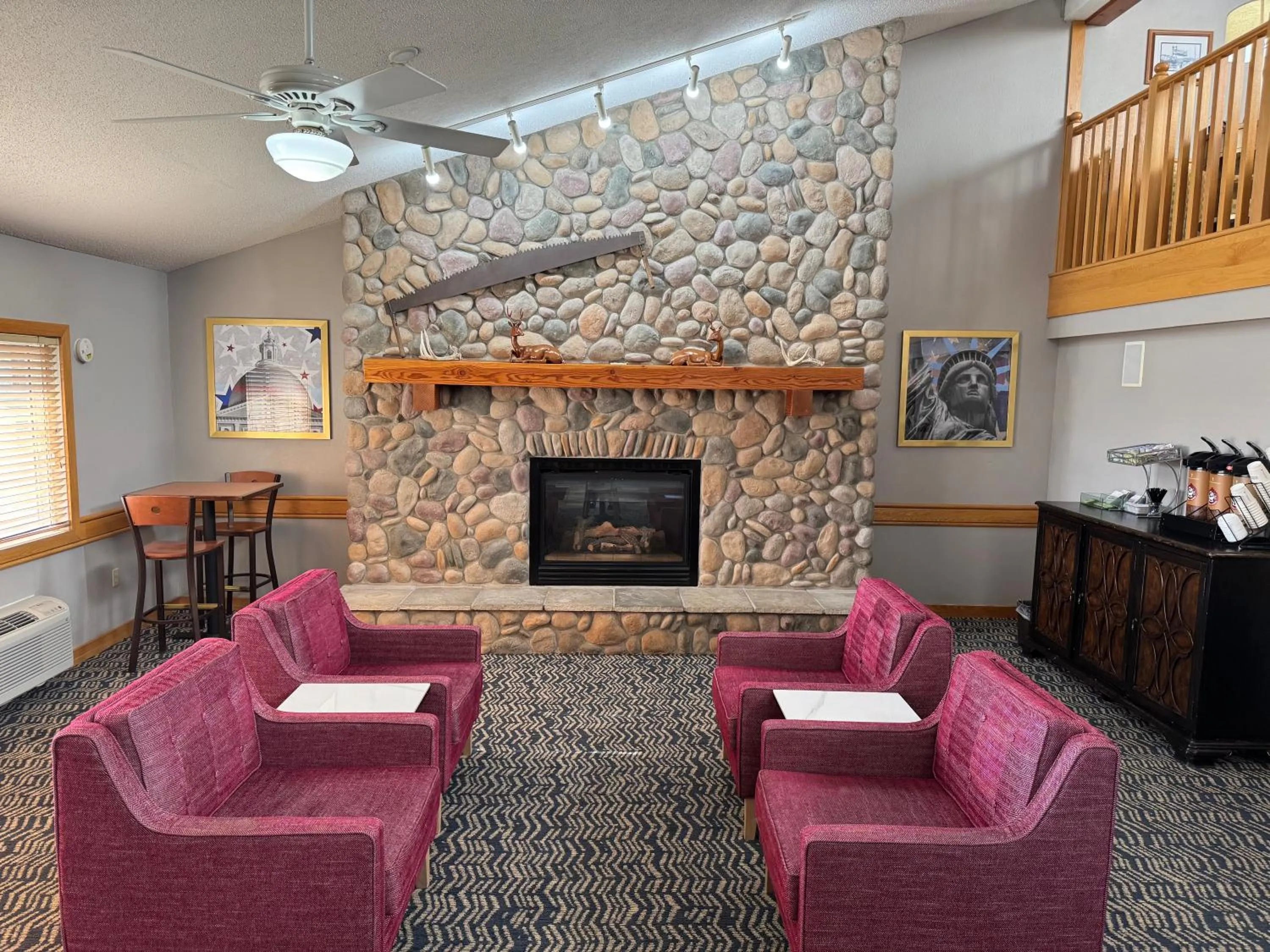 Seating area in AmericInn by Wyndham Stillwater