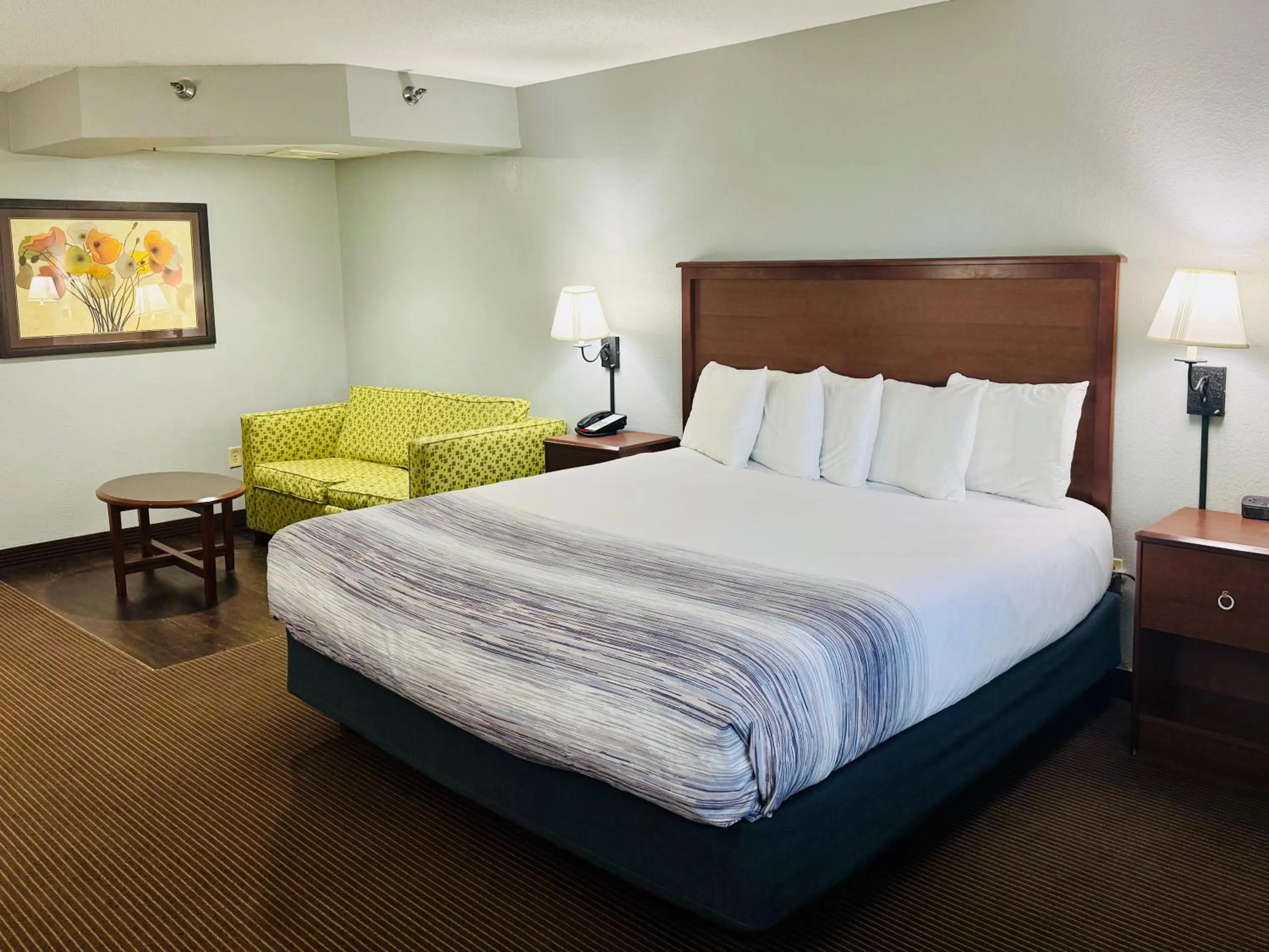 Bed in AmericInn by Wyndham Stillwater