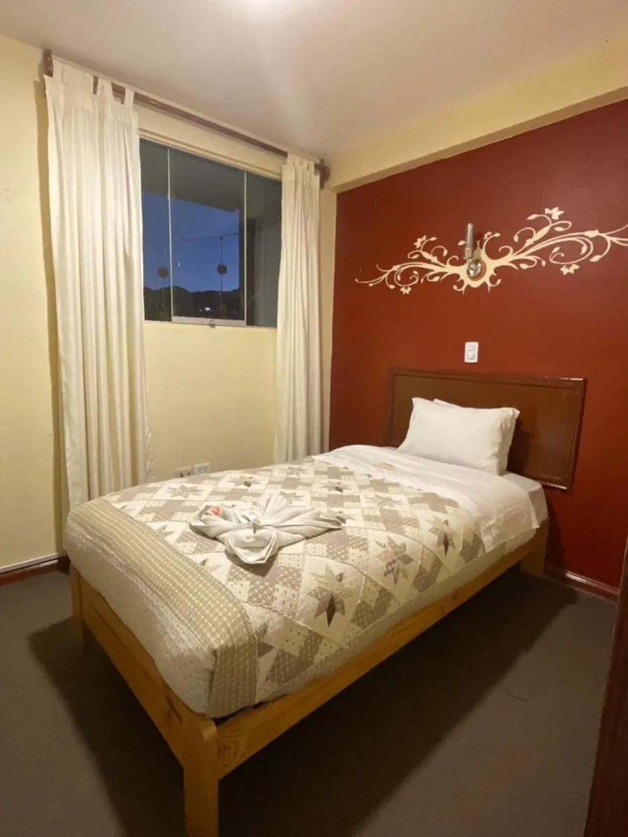 Bed in Hotel Andean Host Inn