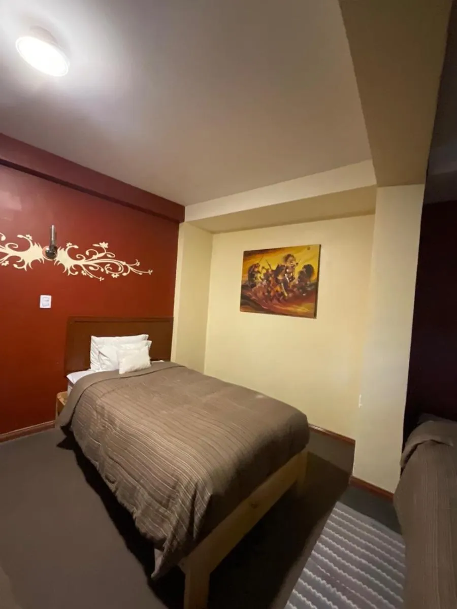 Bed in Hotel Andean Host Inn