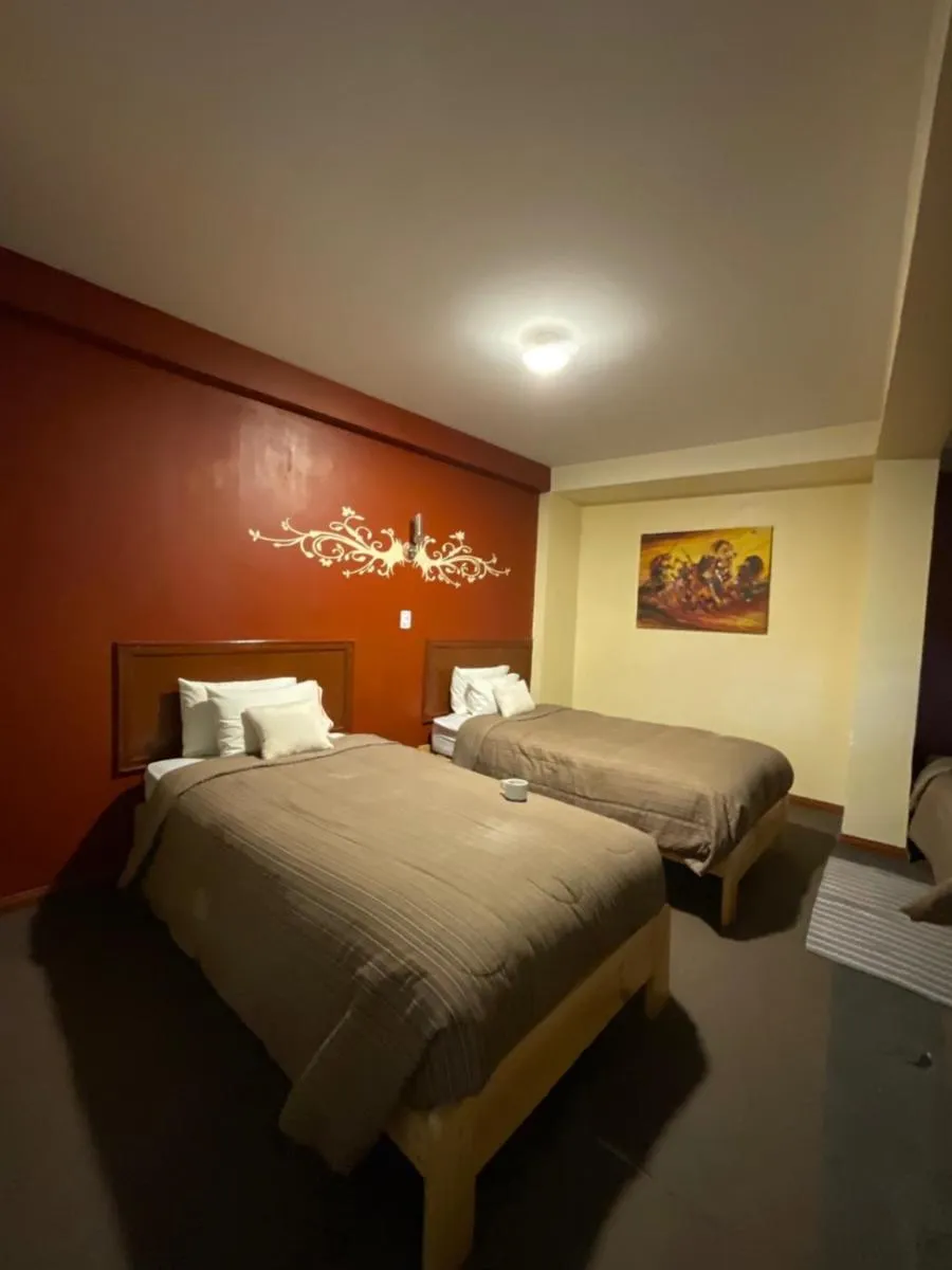 Bed in Hotel Andean Host Inn