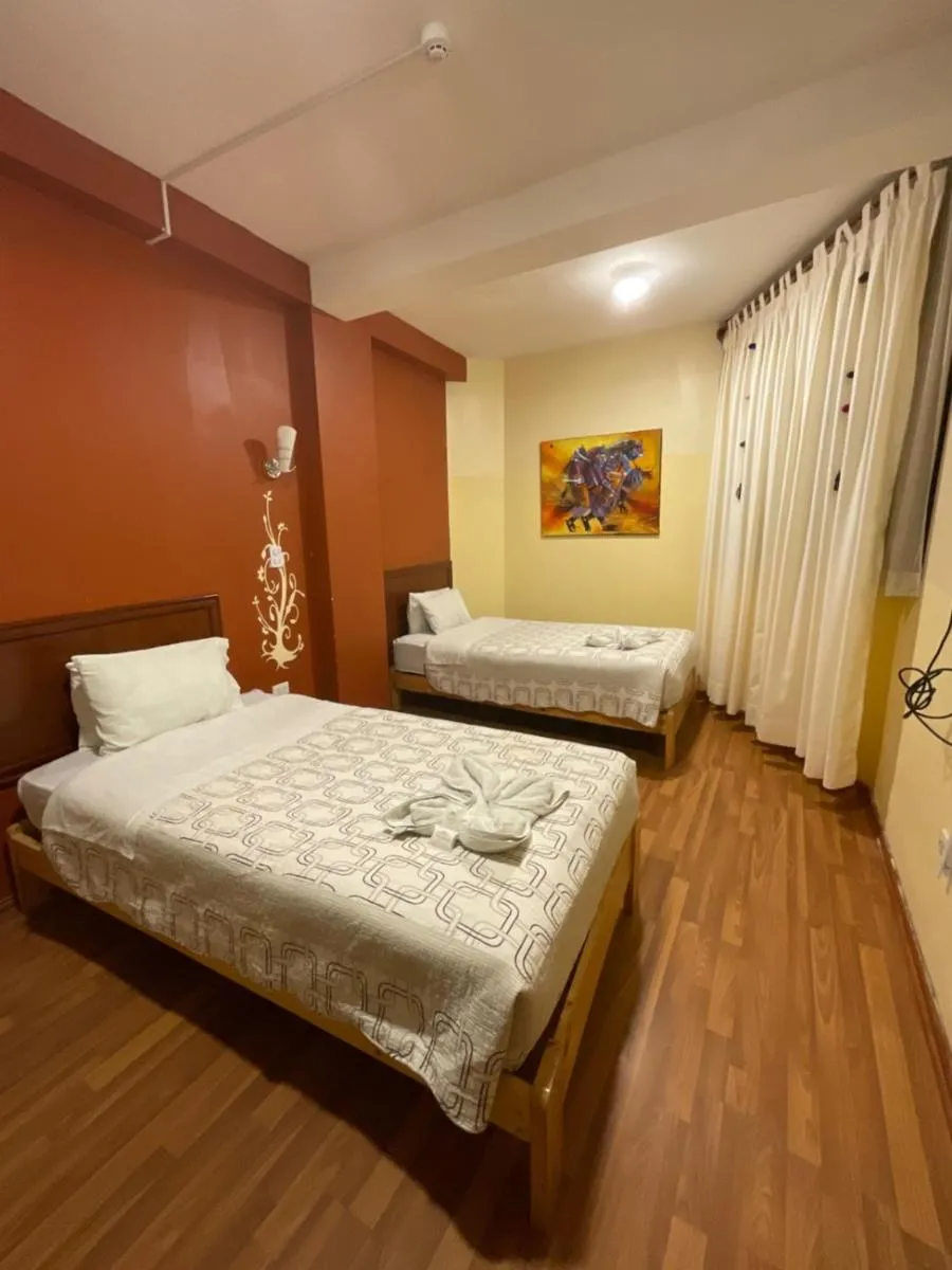 Bed in Hotel Andean Host Inn