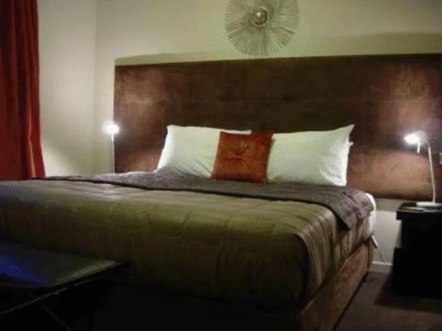 Bed in Terra Vive Suites & Apartments