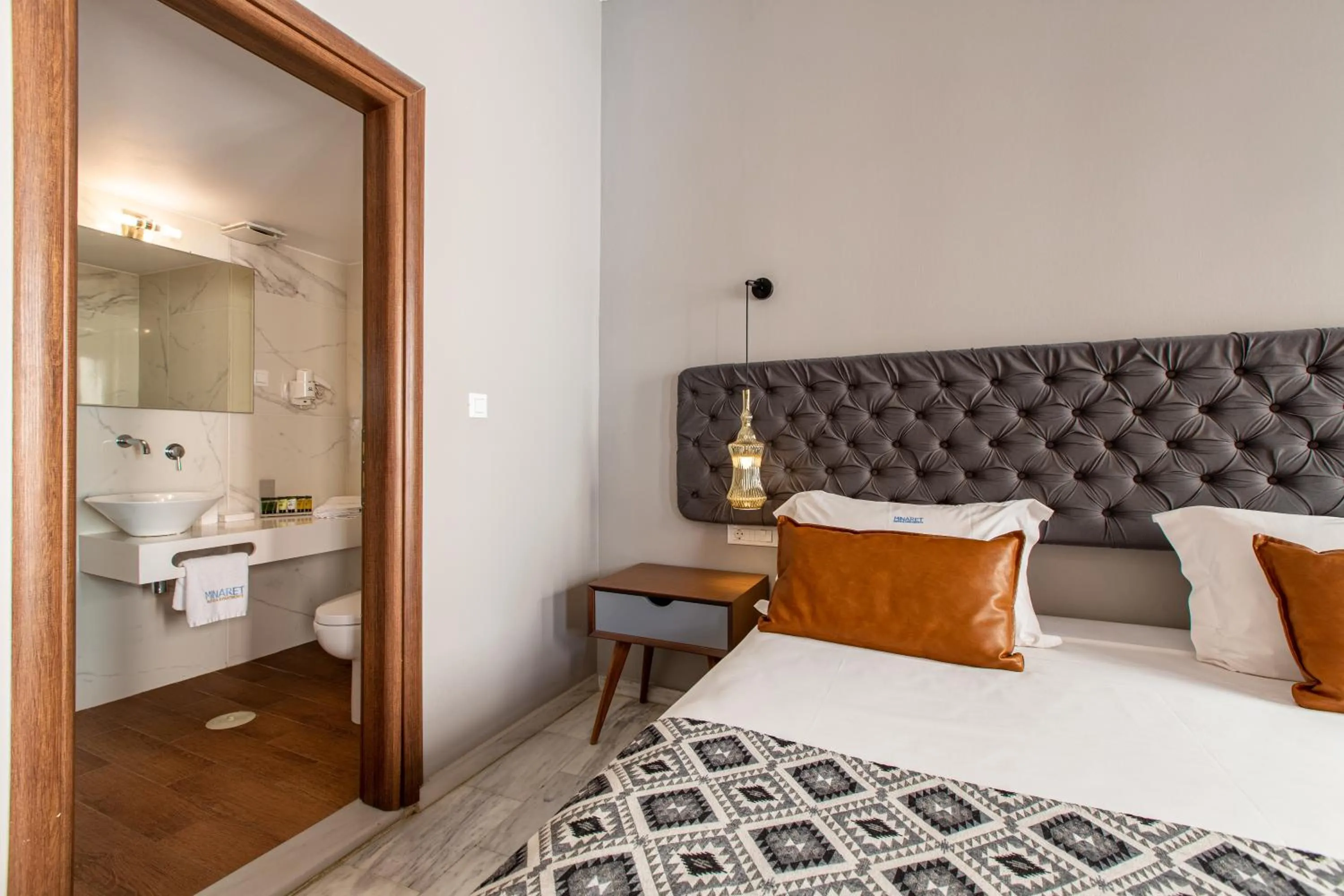 Bed in Minaret Suites and Apartments