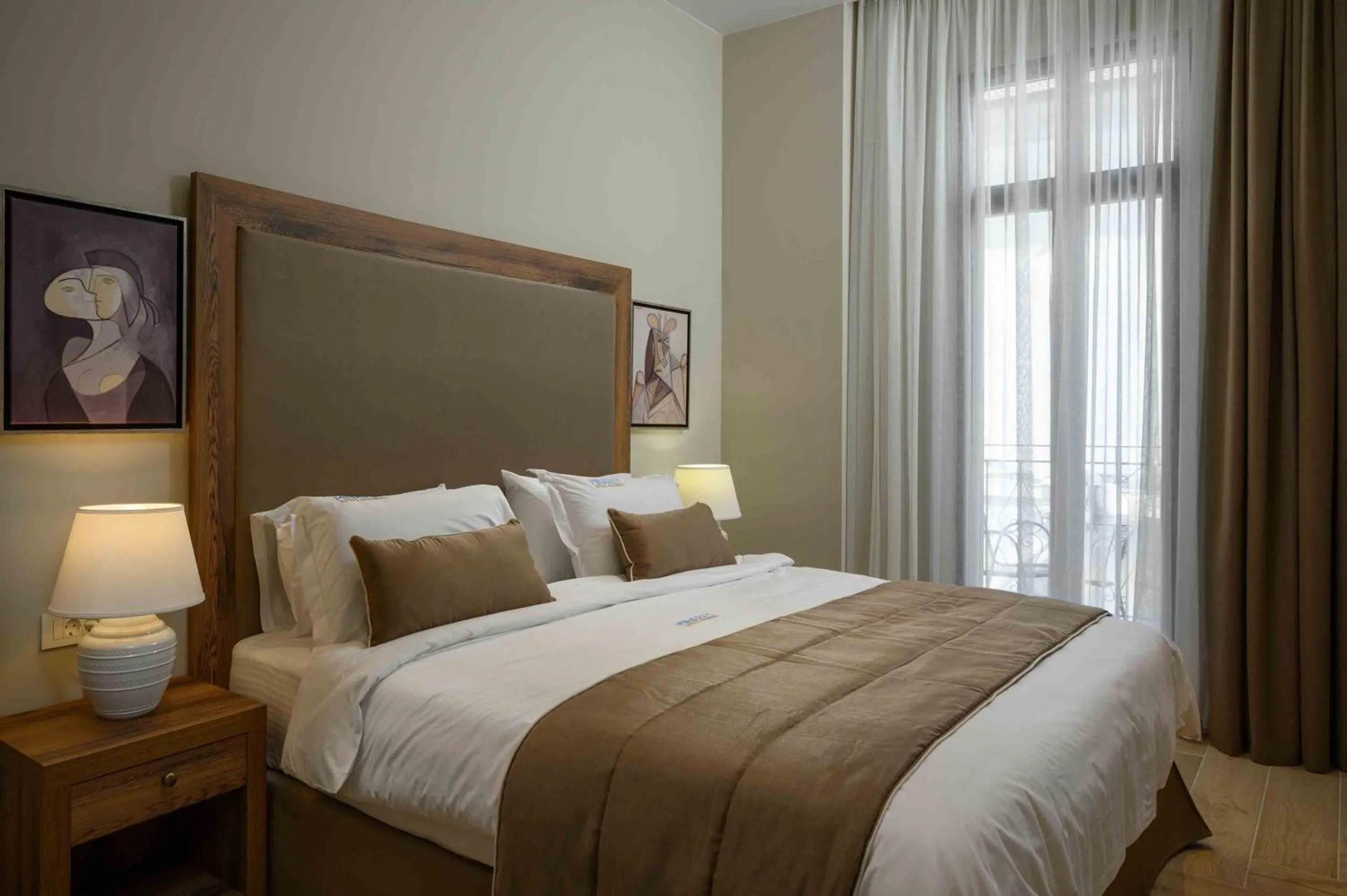 Bed in Minaret Suites and Apartments