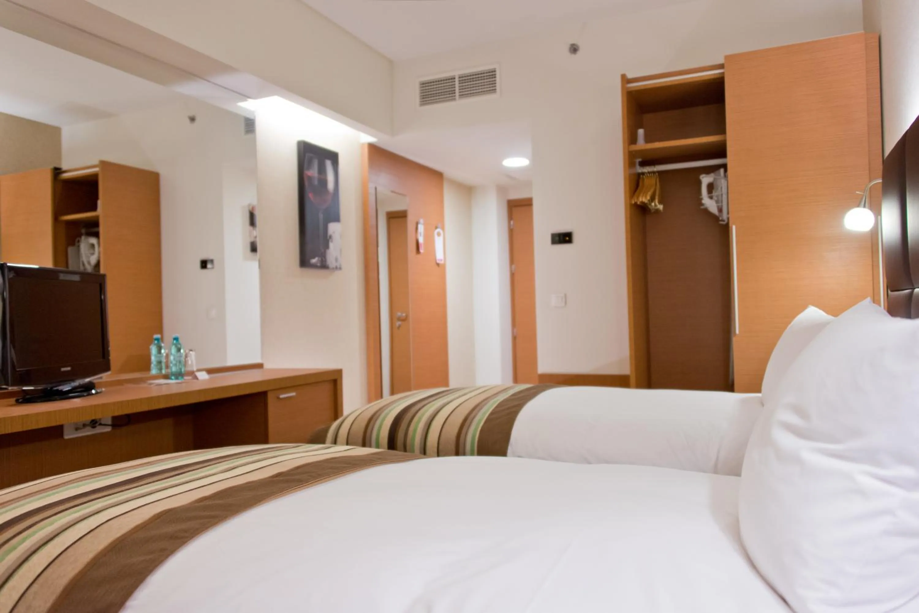 Bed in Ramada by Wyndham Oradea