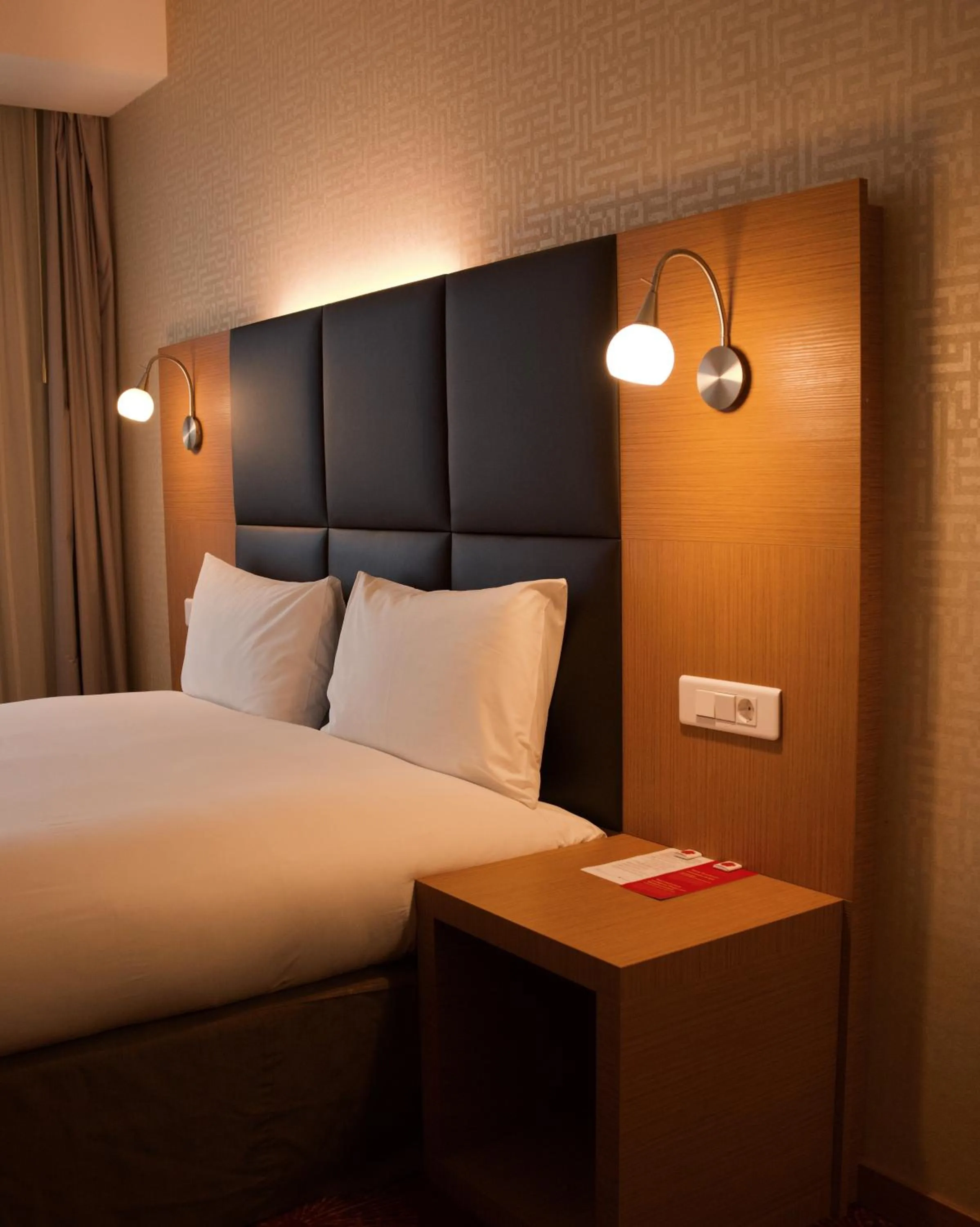 Bed in Ramada by Wyndham Oradea