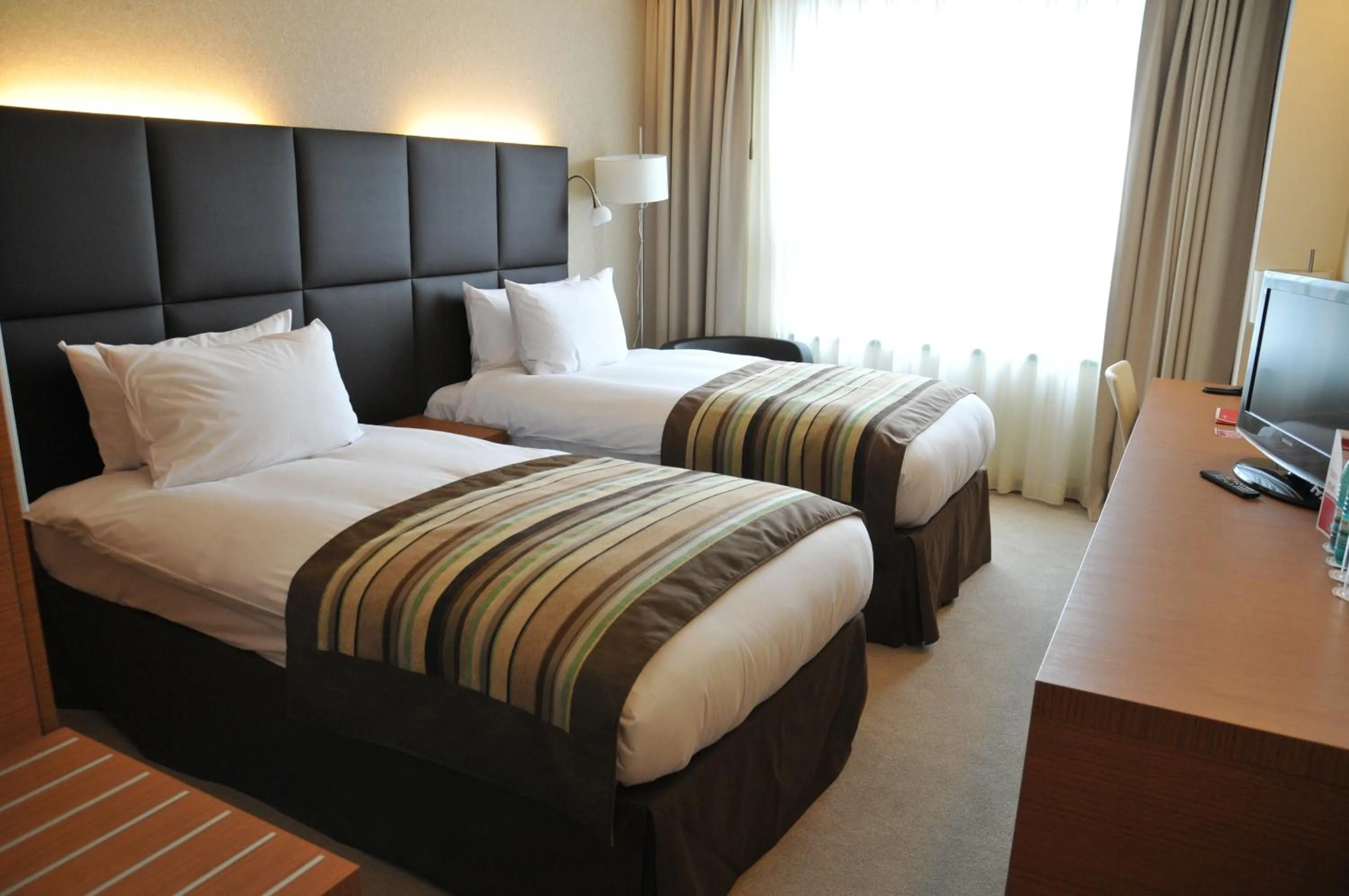 Bed in Ramada by Wyndham Oradea