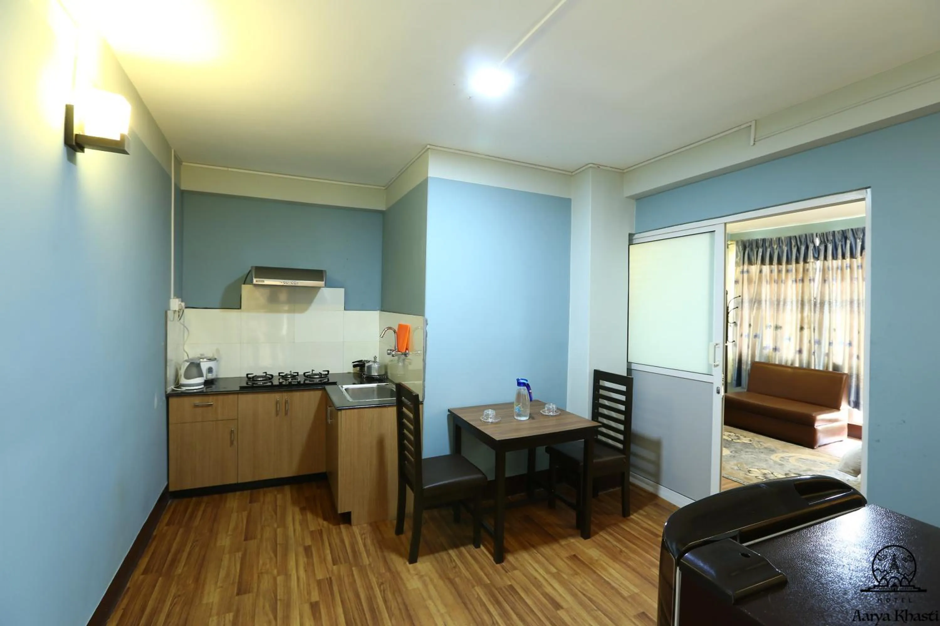 Kitchen or kitchenette in Aarya Chaitya Inn