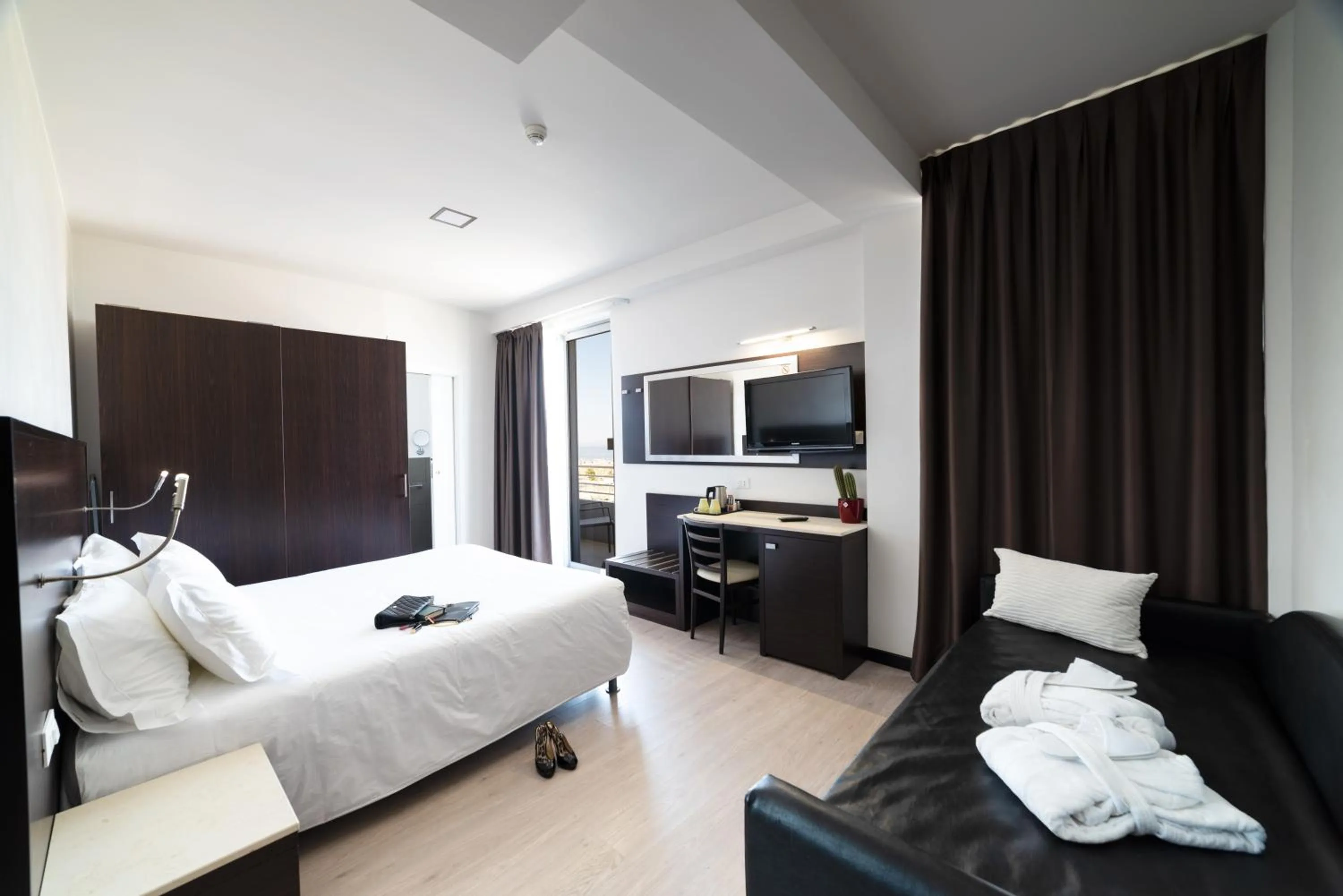 Bed in Alisei Palace Hotel