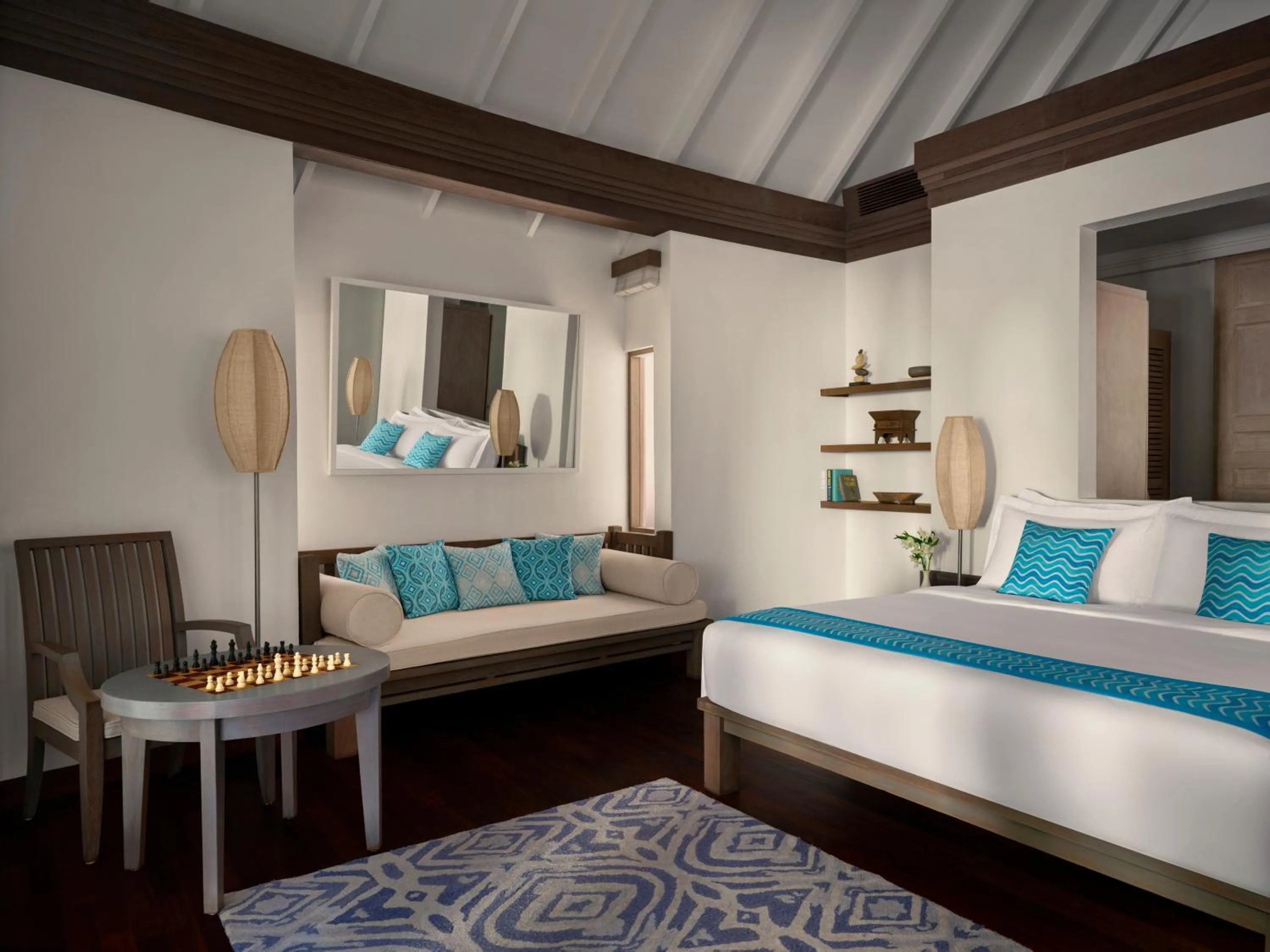 Seating area, Bed in Anantara Dhigu Maldives Resort