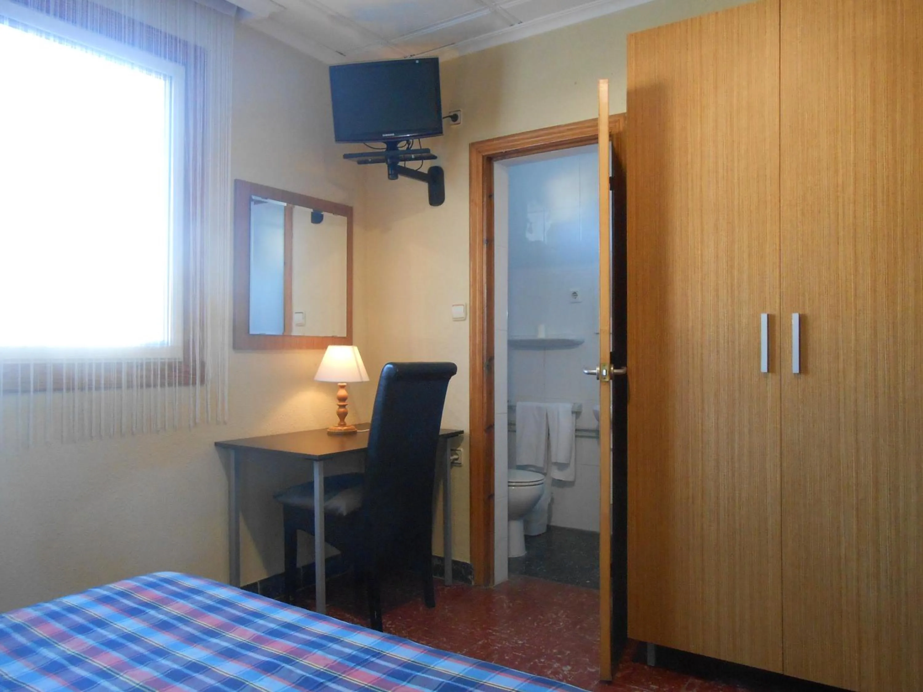 Bed in Hostal El Callejón