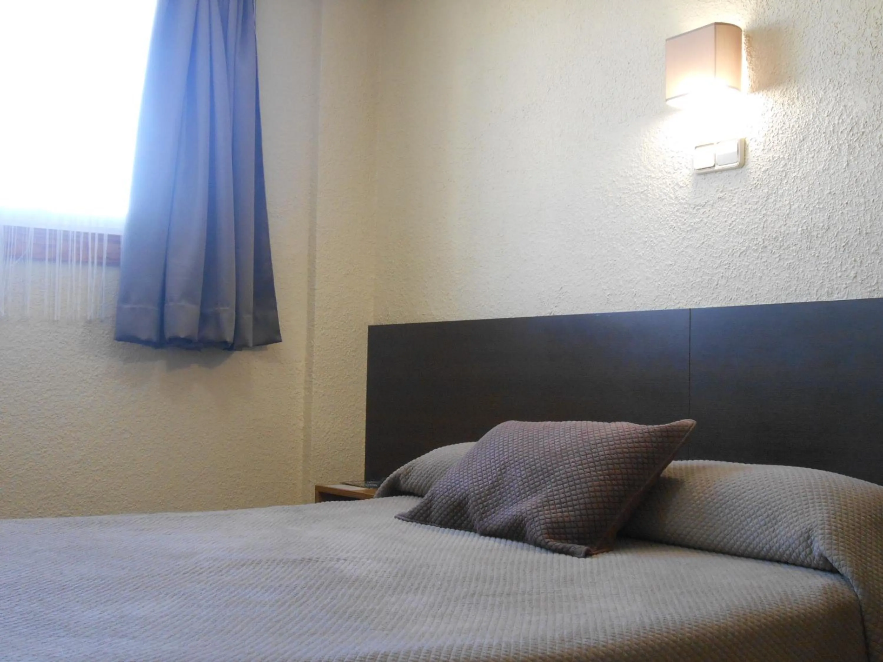 Bed in Hostal El Callejón