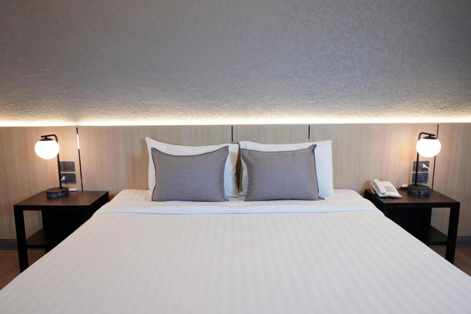 Bed in King Park Avenue Hotel Bangkok