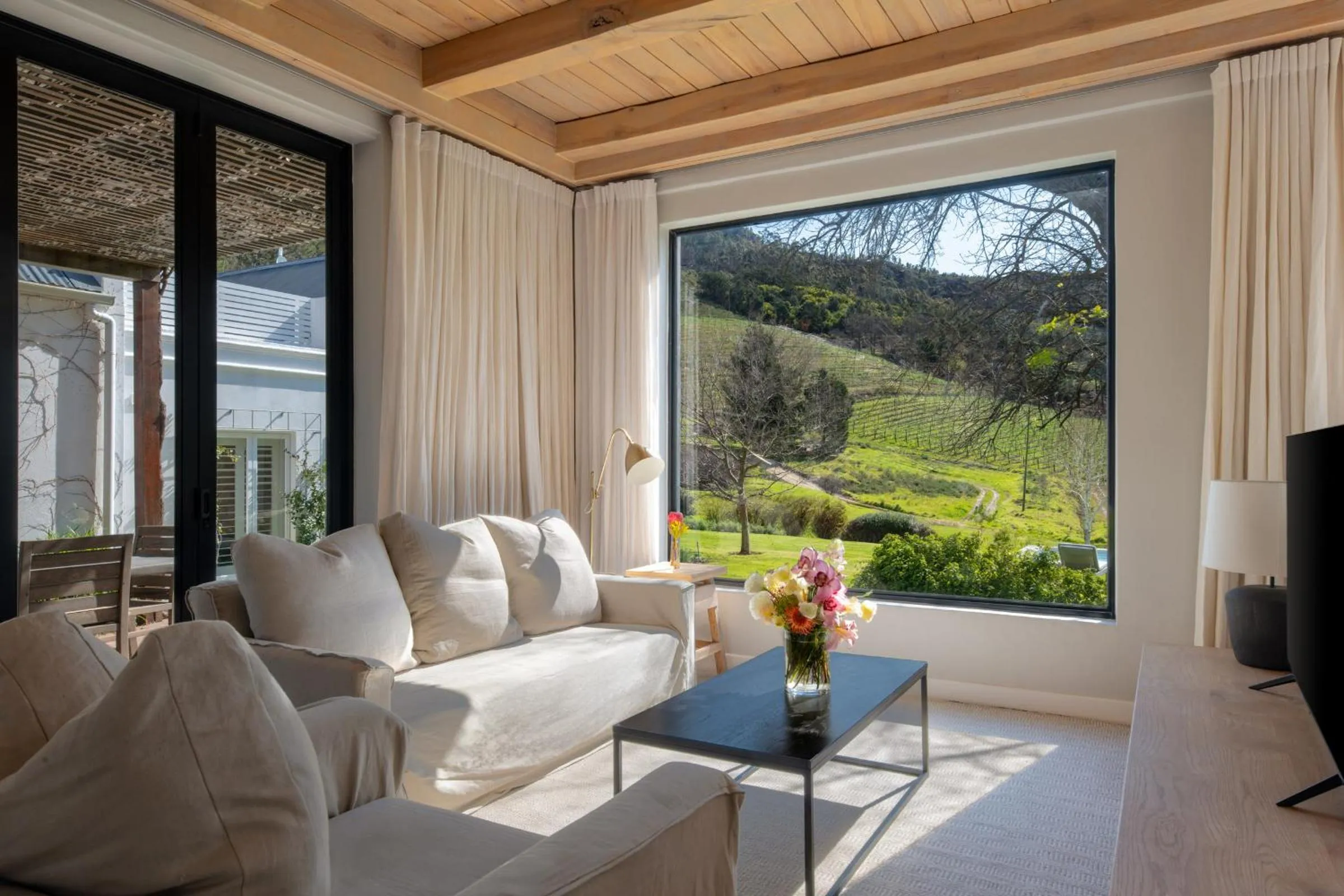 Communal lounge/ TV room in Mont Rochelle Hotel and Vineyard