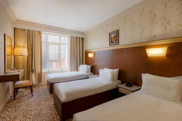 Photo of the whole room, Bed in Dhiafat Al Raja Hotel