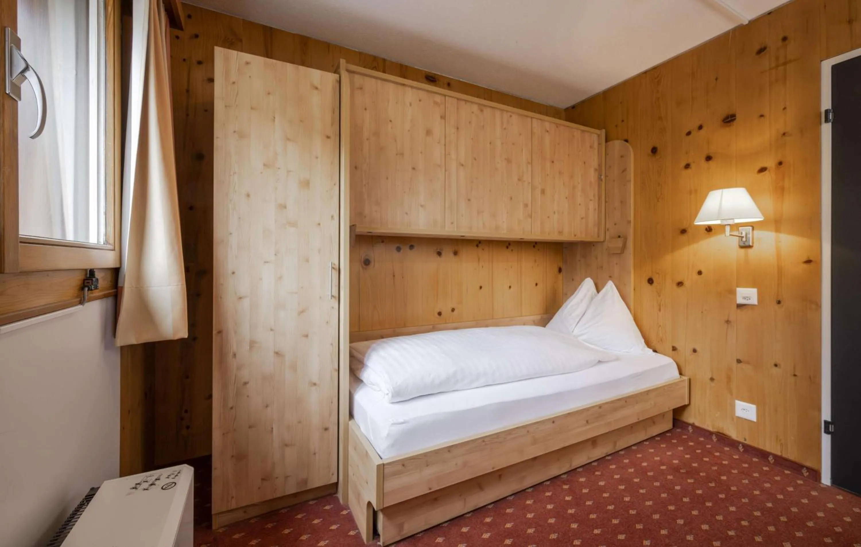 Bed in Hotel Restaurant Bänklialp