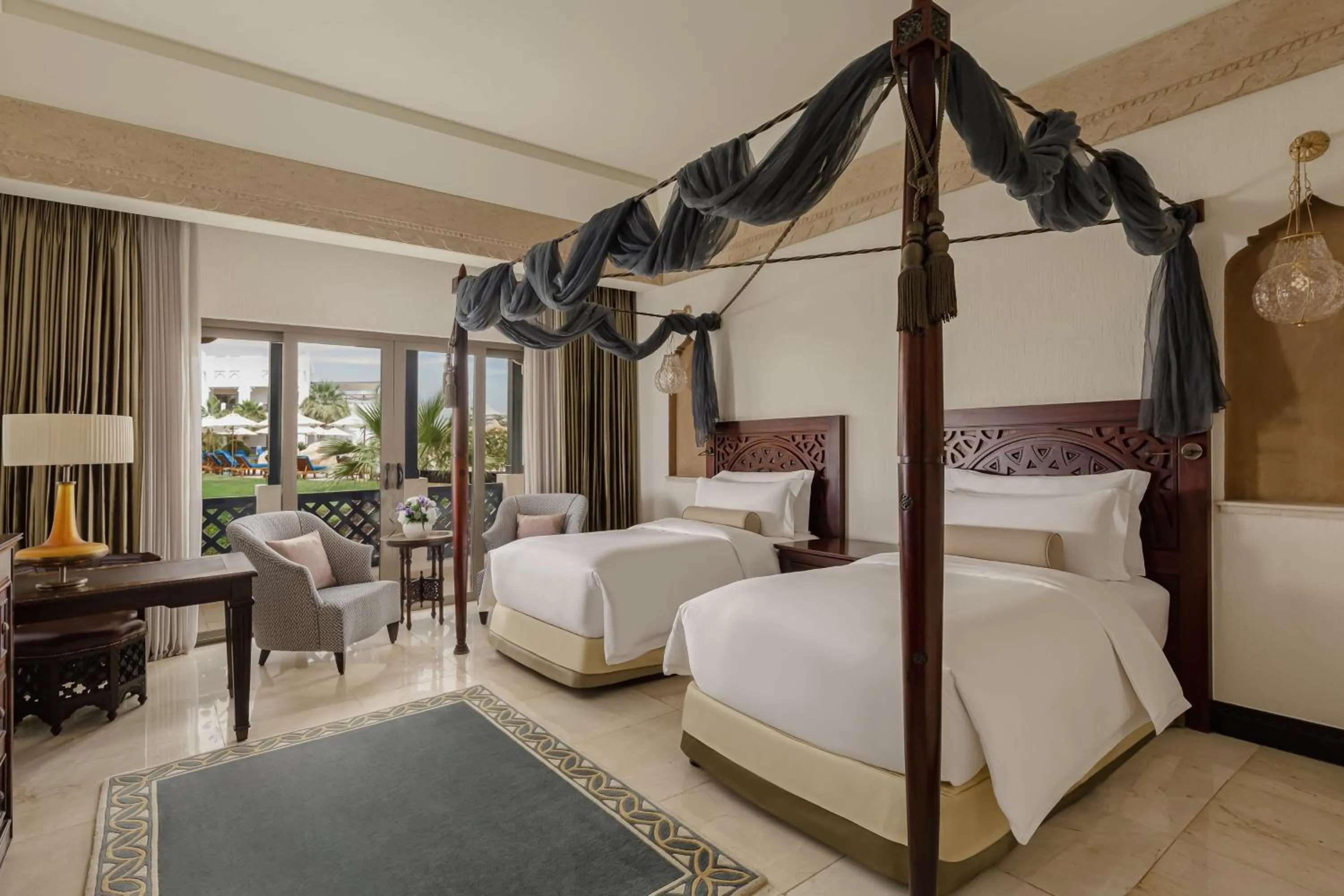 Swimming pool, Bed in Sharq Village & Spa, a Ritz-Carlton Hotel