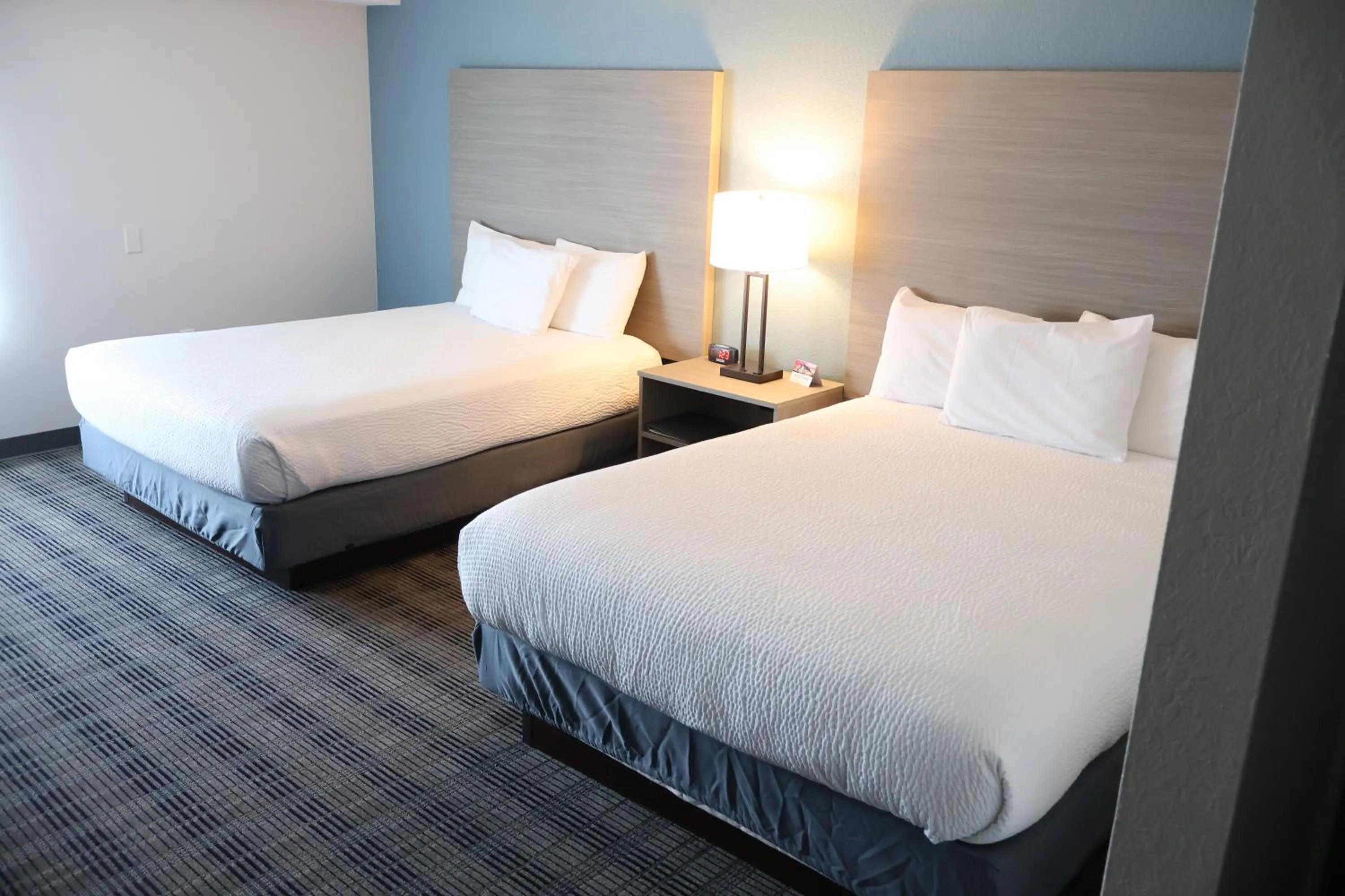 Bedroom, Bed in AmericInn by Wyndham Baxter Brainerd