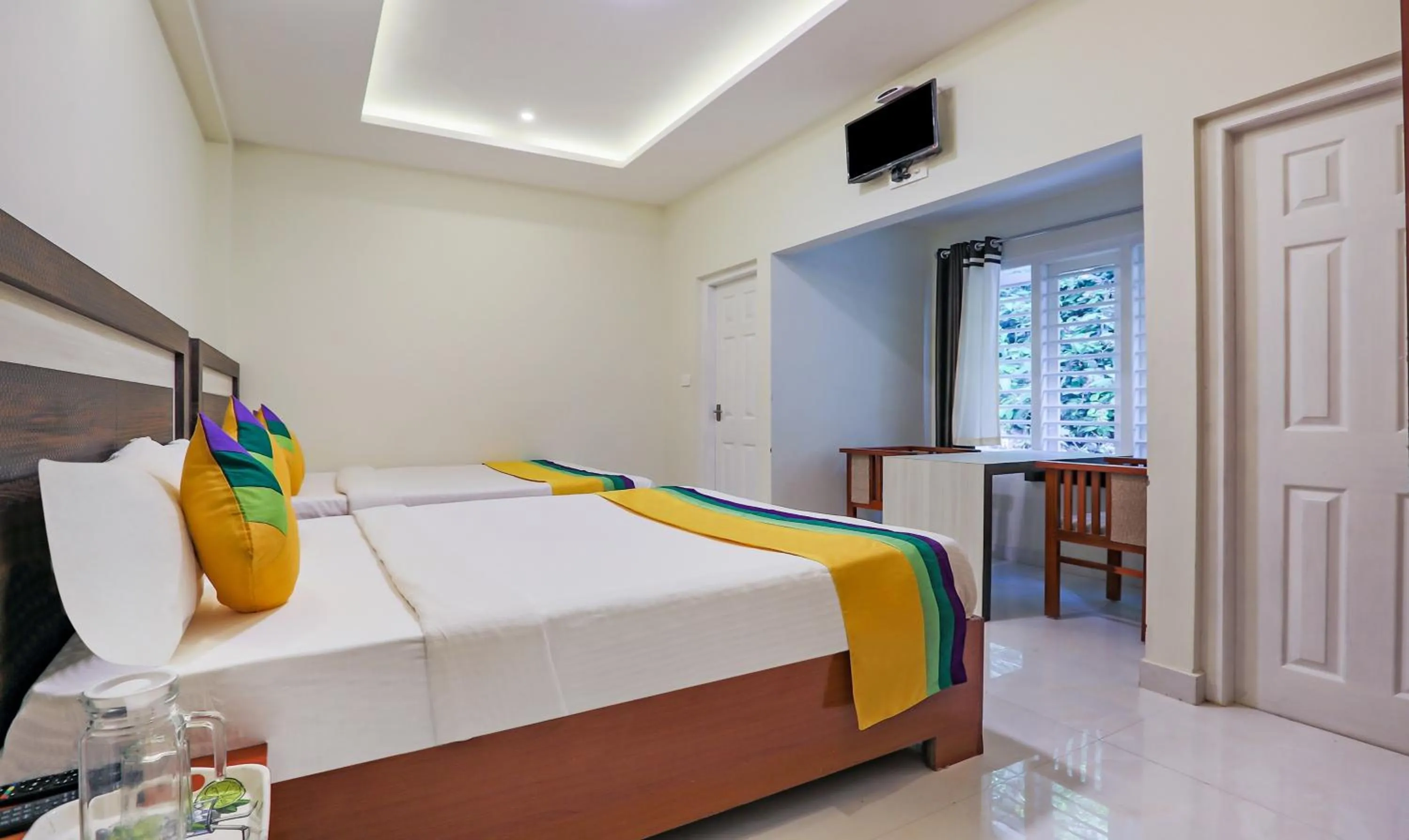Bedroom, Bed in Itsy Hotels Kottaram Residency, 10 Mins To Botanical Garden