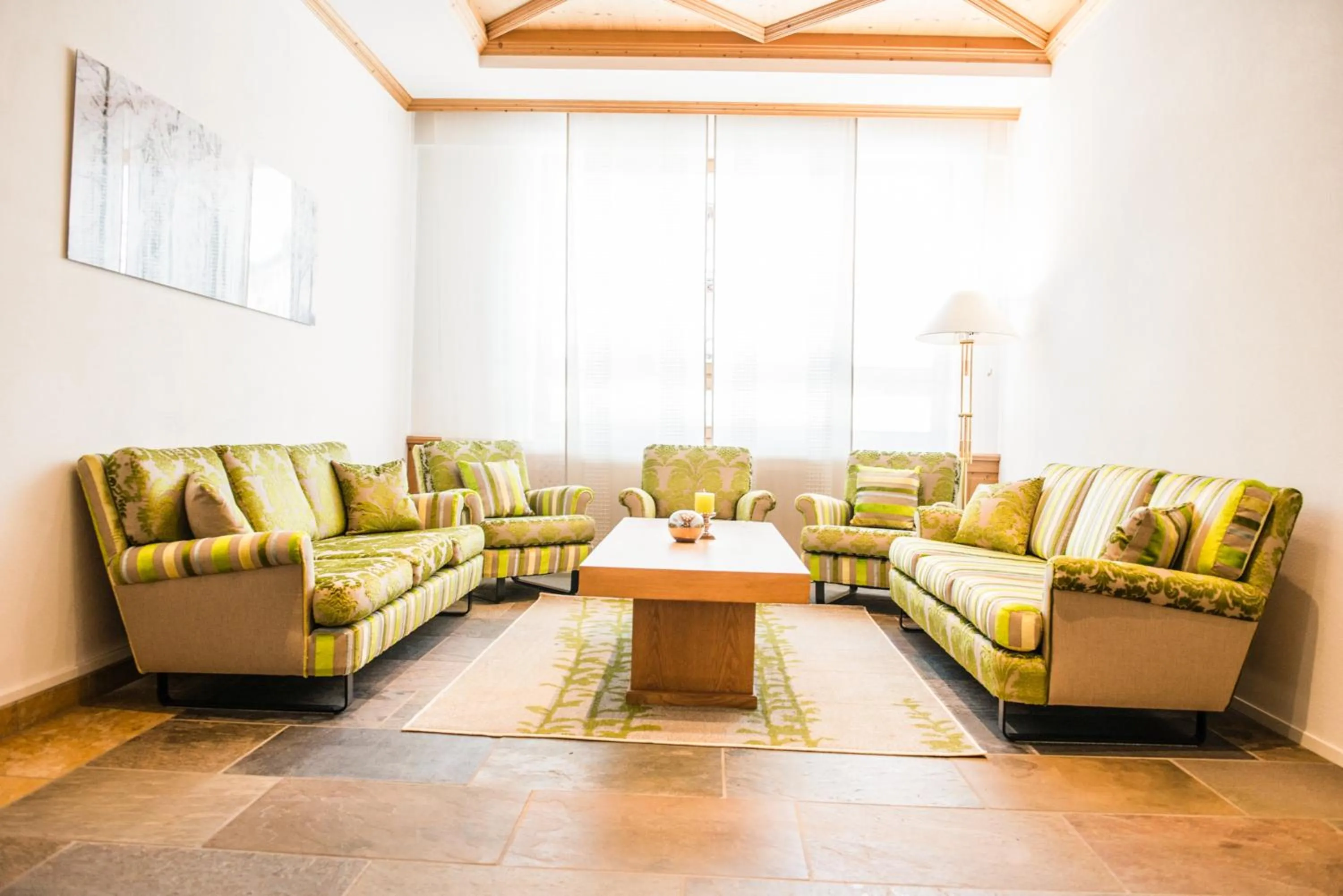 Communal lounge/ TV room in Posthotel Valbella - Berge, Spa & Wir