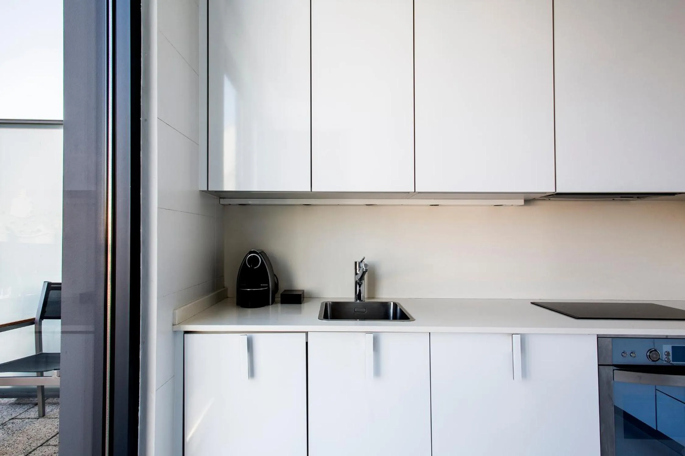 Kitchen or kitchenette in Suites Avenue