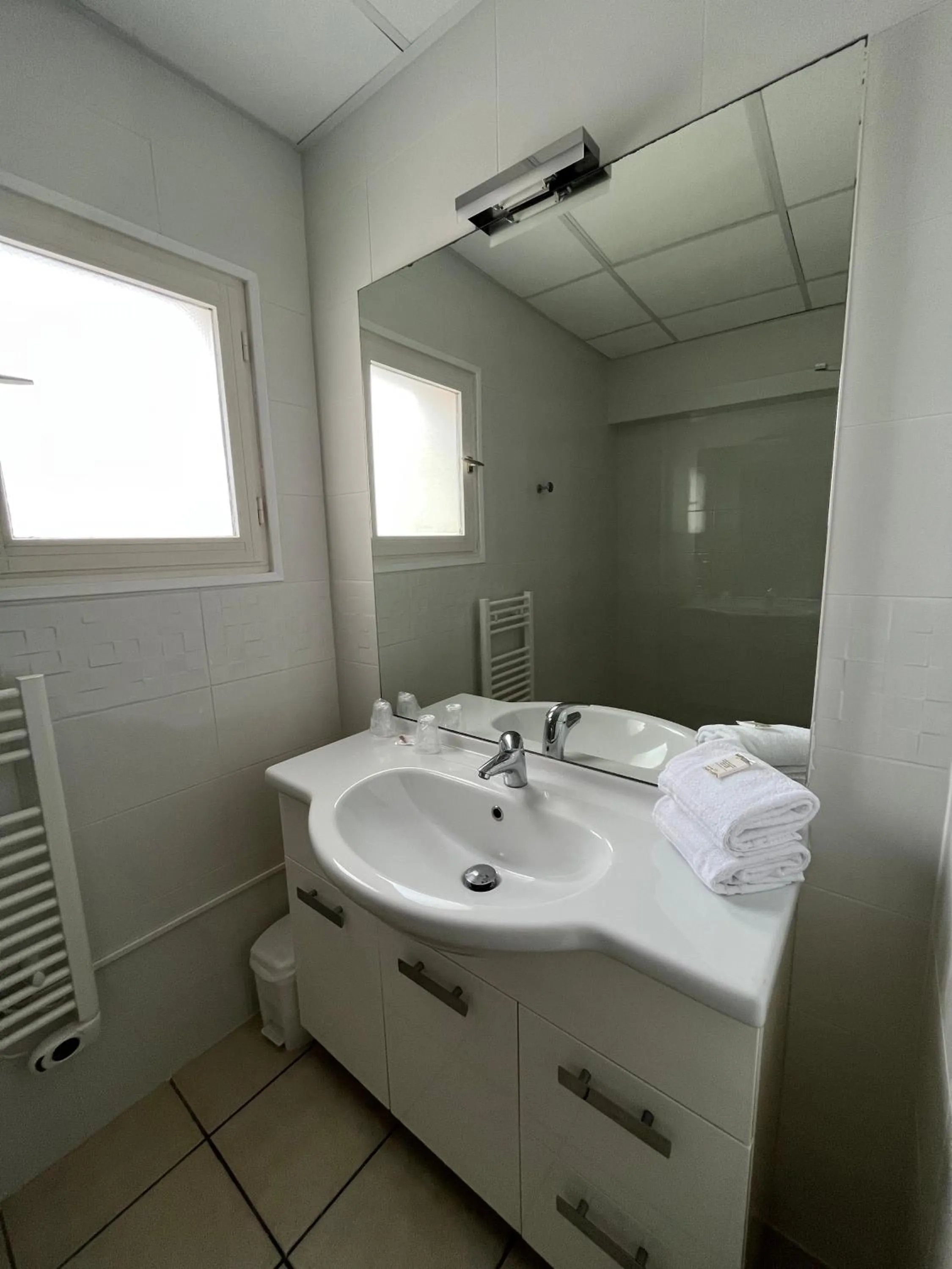 Bathroom in Hôtel Les Sables - Urban Style - by Logis Hotels