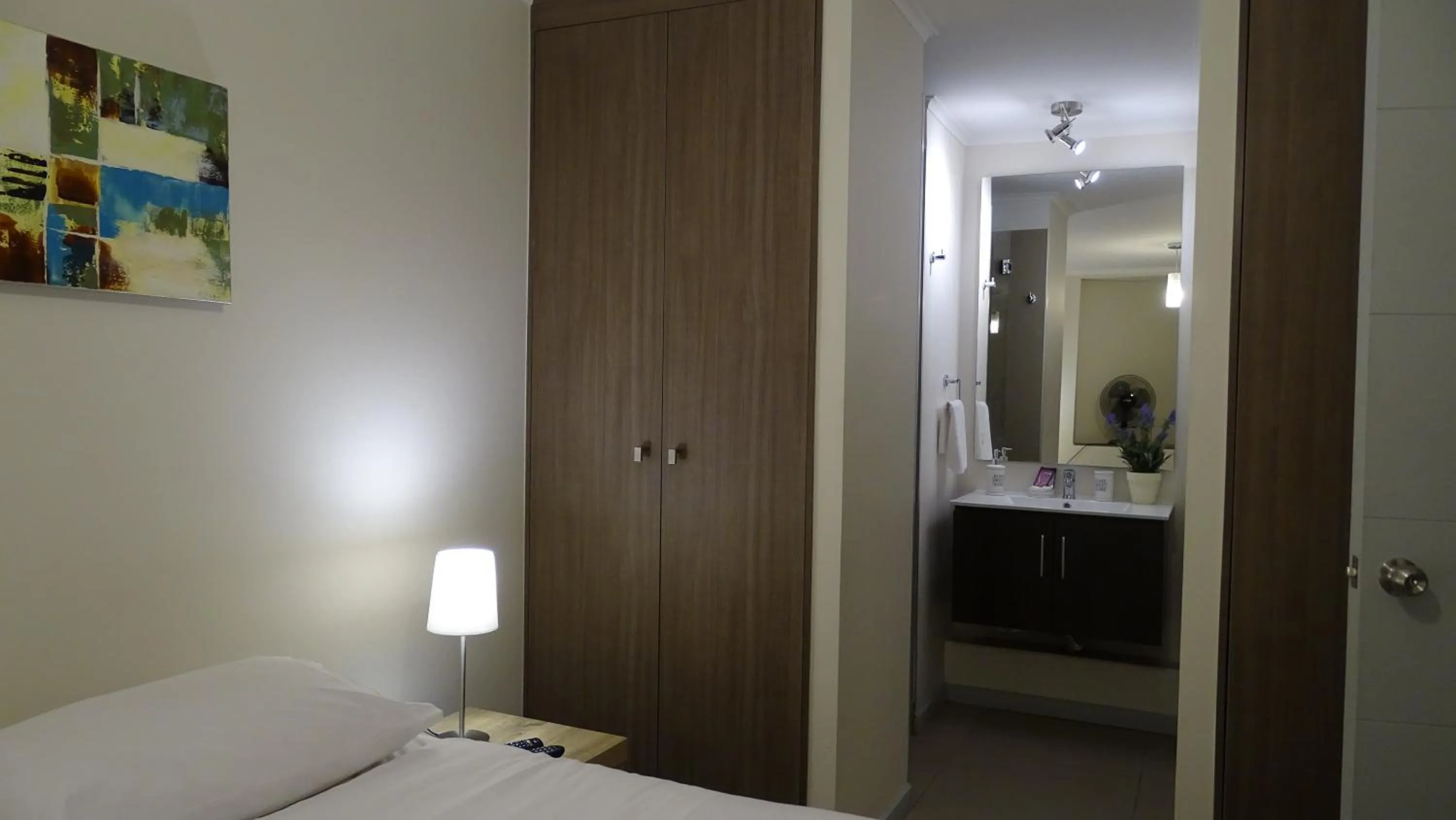 Bed in Moneda Express Apart