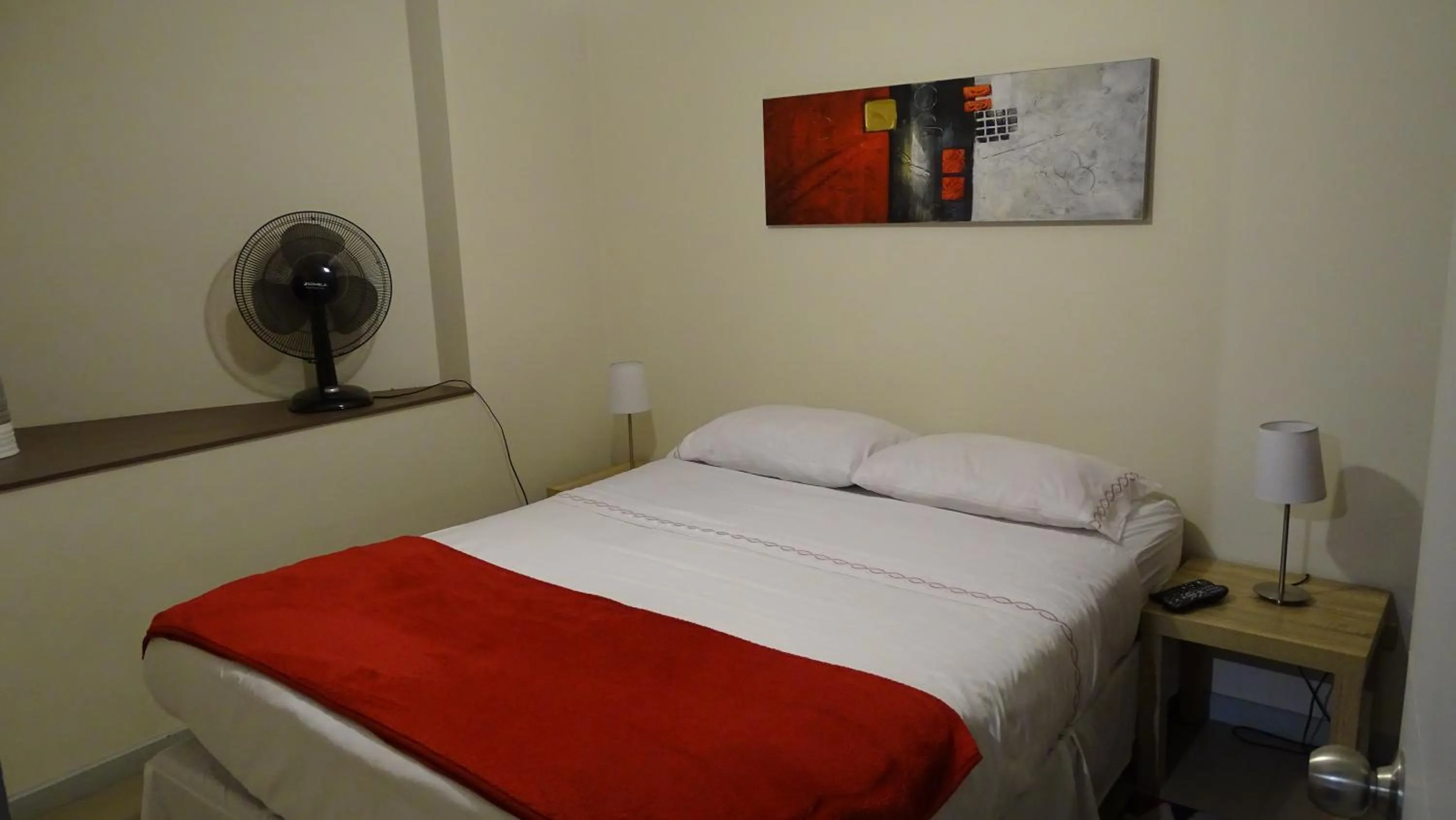 Bed in Moneda Express Apart