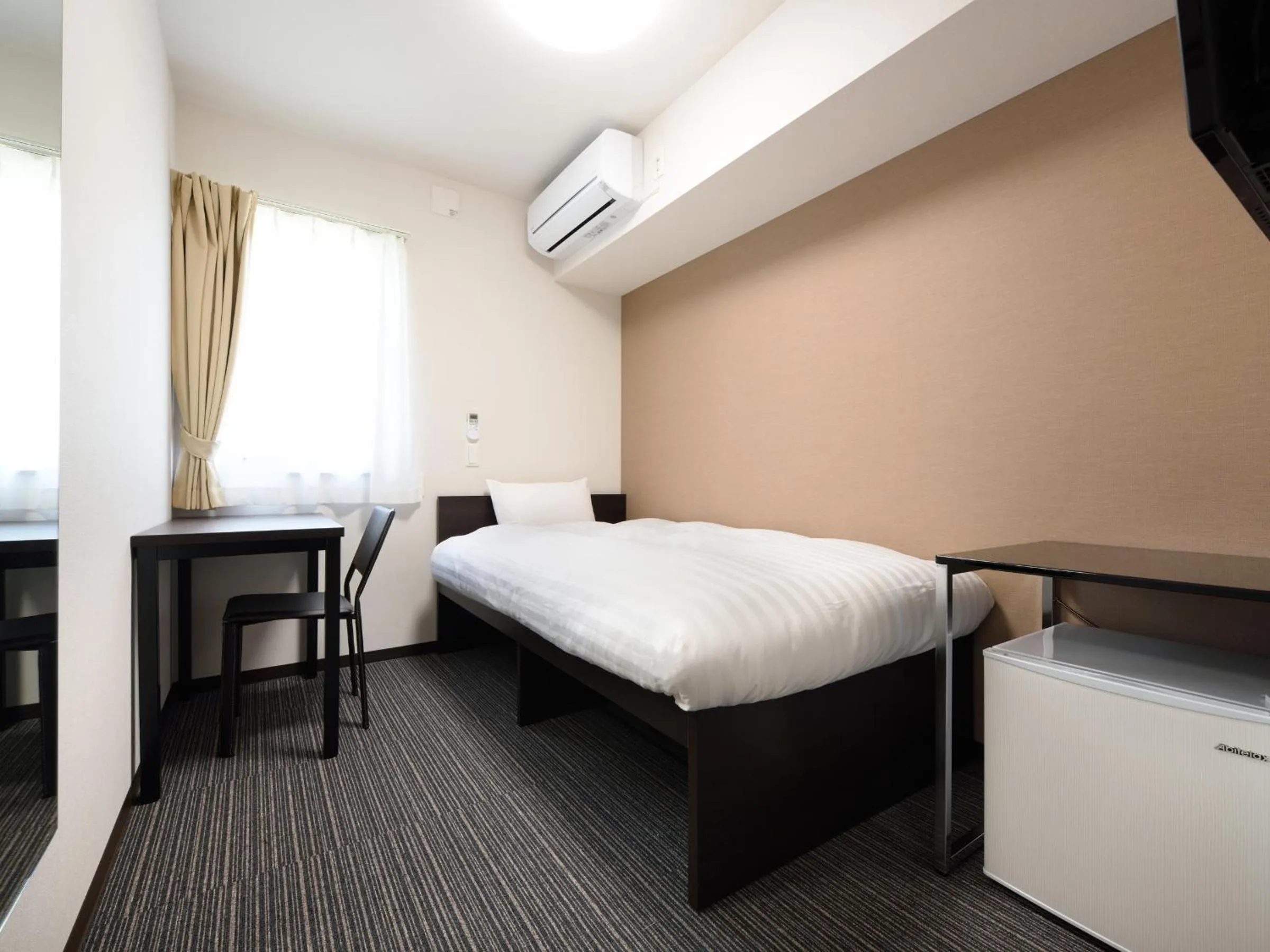 Bed in La'gent Inn Kesennuma