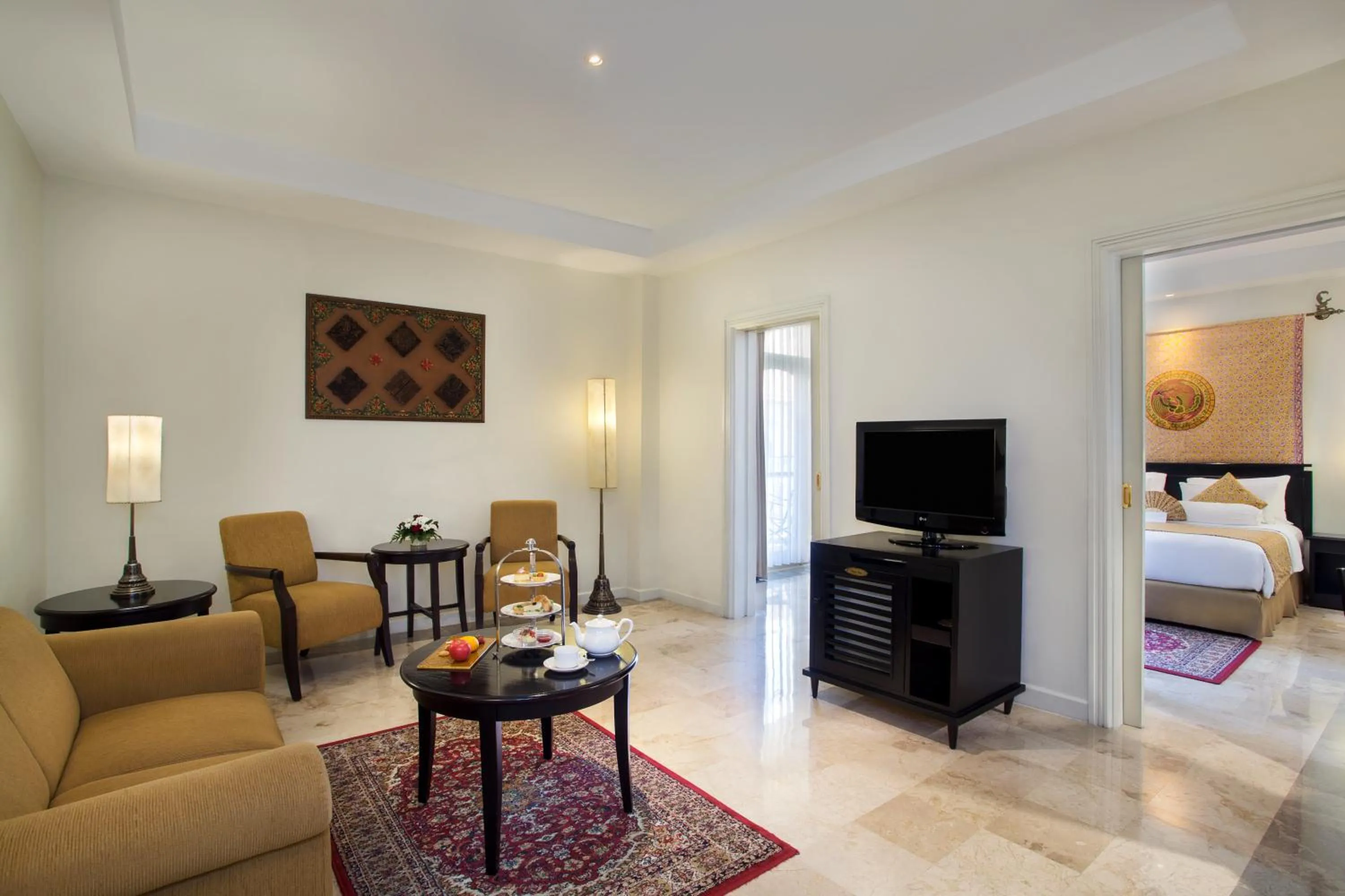 Living room, Bed in The Phoenix Hotel Yogyakarta - Handwritten Collection