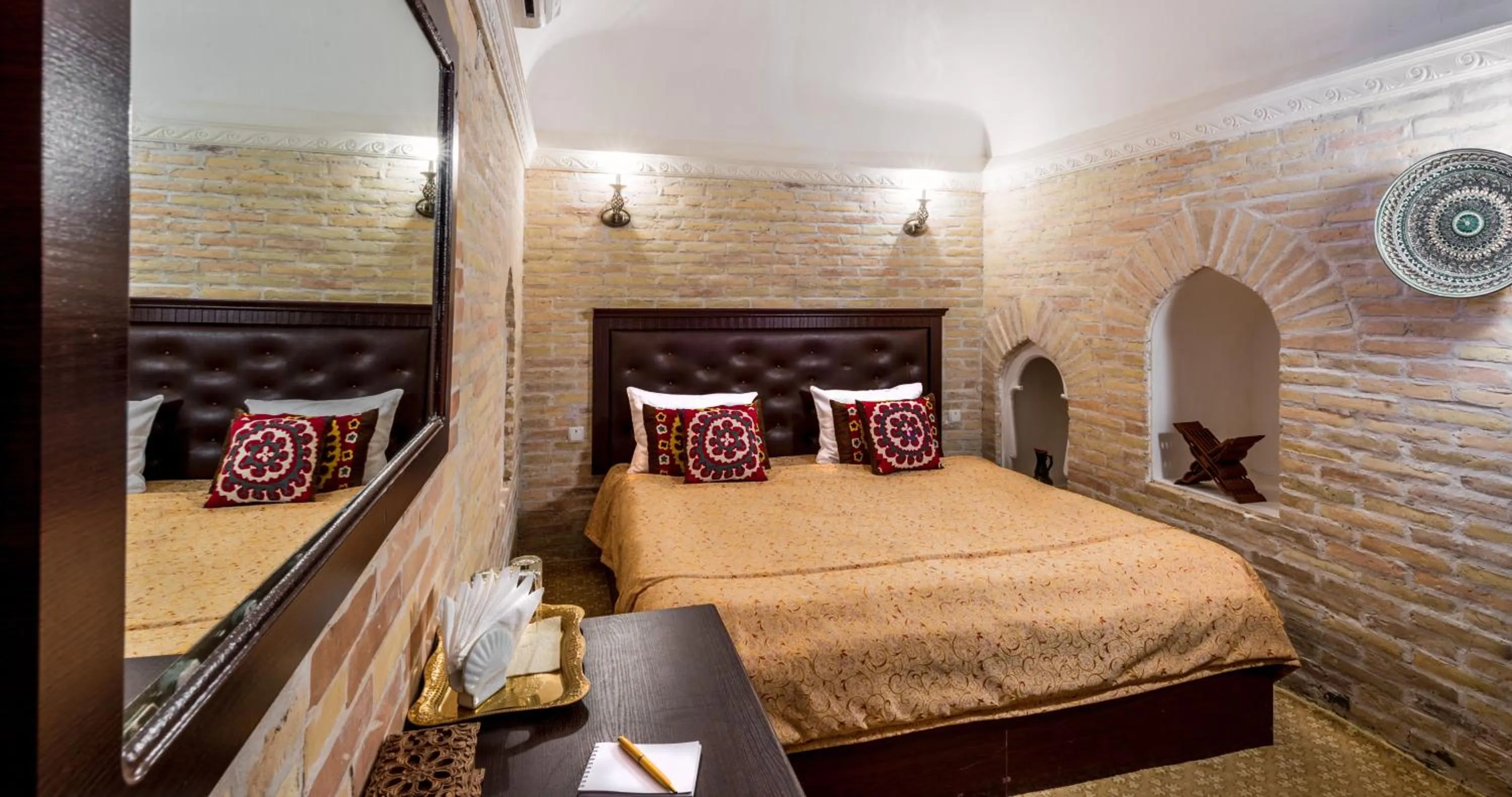 Bed in Orient Star Khiva Hotel- Madrasah Muhammad Aminkhan 1855